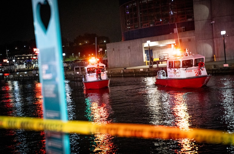 TUESDAY, NOVEMBER 18, 2025 - More than a dozen Baltimore fire trucks and police cars lined the area near the Pier 5 Hotel on Tuesday as divers and rescue boats searched for a vehicle that plunged into the water.
