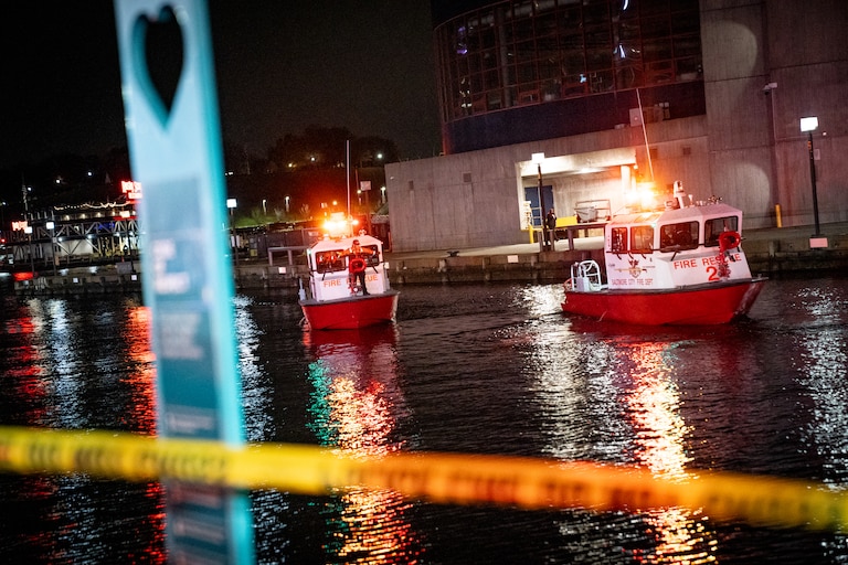 TUESDAY, NOVEMBER 18, 2025 - More than a dozen Baltimore fire trucks and police cars lined the area near the Pier 5 Hotel on Tuesday as divers and rescue boats searched for a vehicle that plunged into the water.