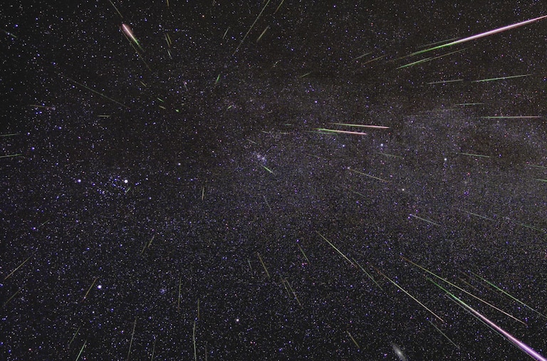 An outburst of Perseid meteors lights up the sky in August 2009 in this time-lapse image. Stargazers expect a similar outburst during next week’s Perseid meteor shower, which will be visible overnight on Aug. 11 and 12.