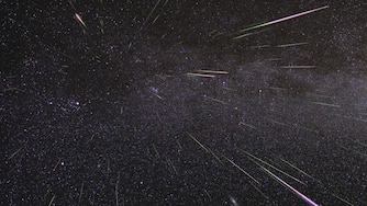 An outburst of Perseid meteors lights up the sky in August 2009 in this time-lapse image. Stargazers expect a similar outburst during next week’s Perseid meteor shower, which will be visible overnight on Aug. 11 and 12.