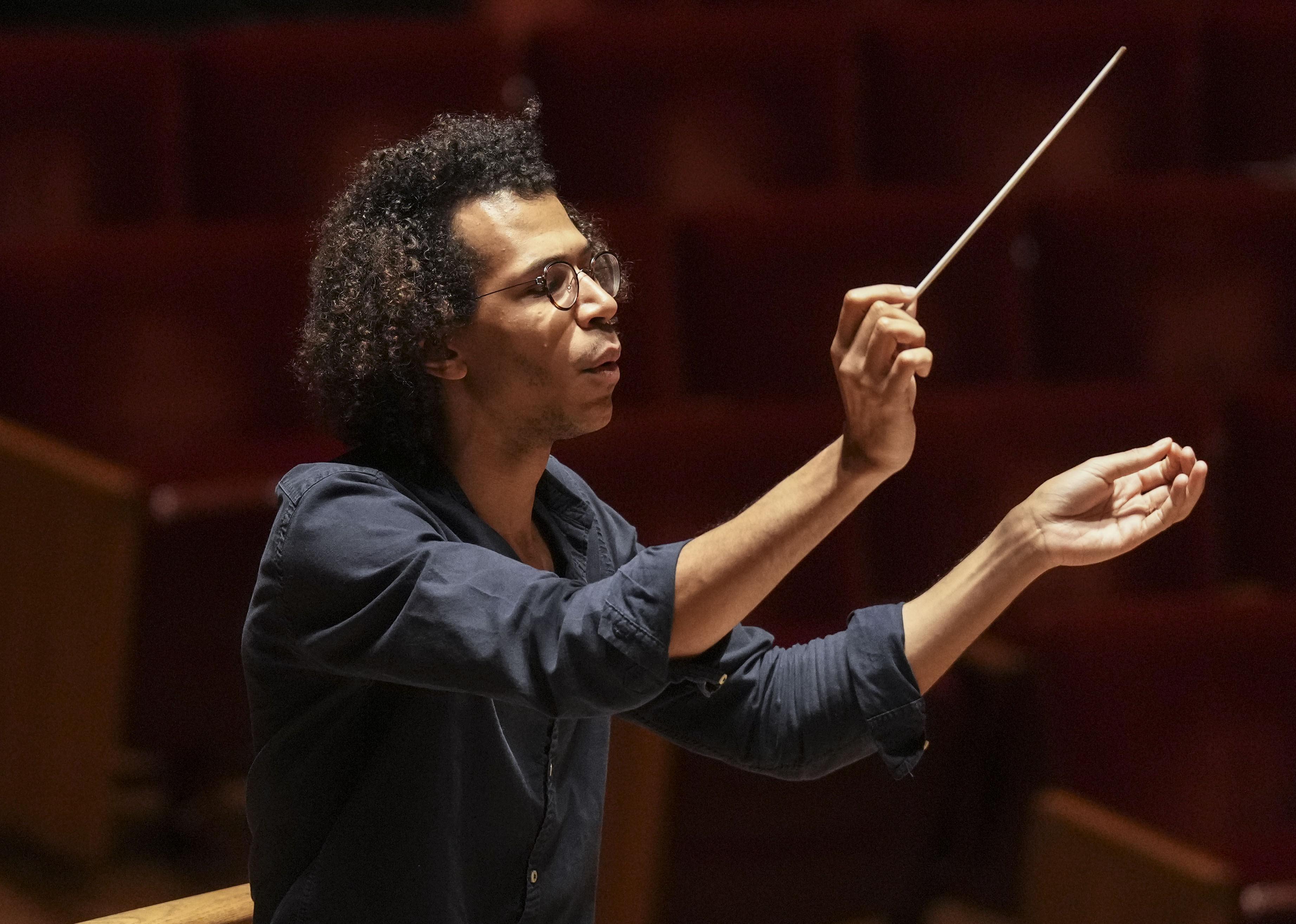 Jonathon Heyward, Music Director of the Baltimore Symphony Orchestra goes through rehearsal at Joseph Meyerhoff Symphony Hall, Tuesday, May 2, 2023.