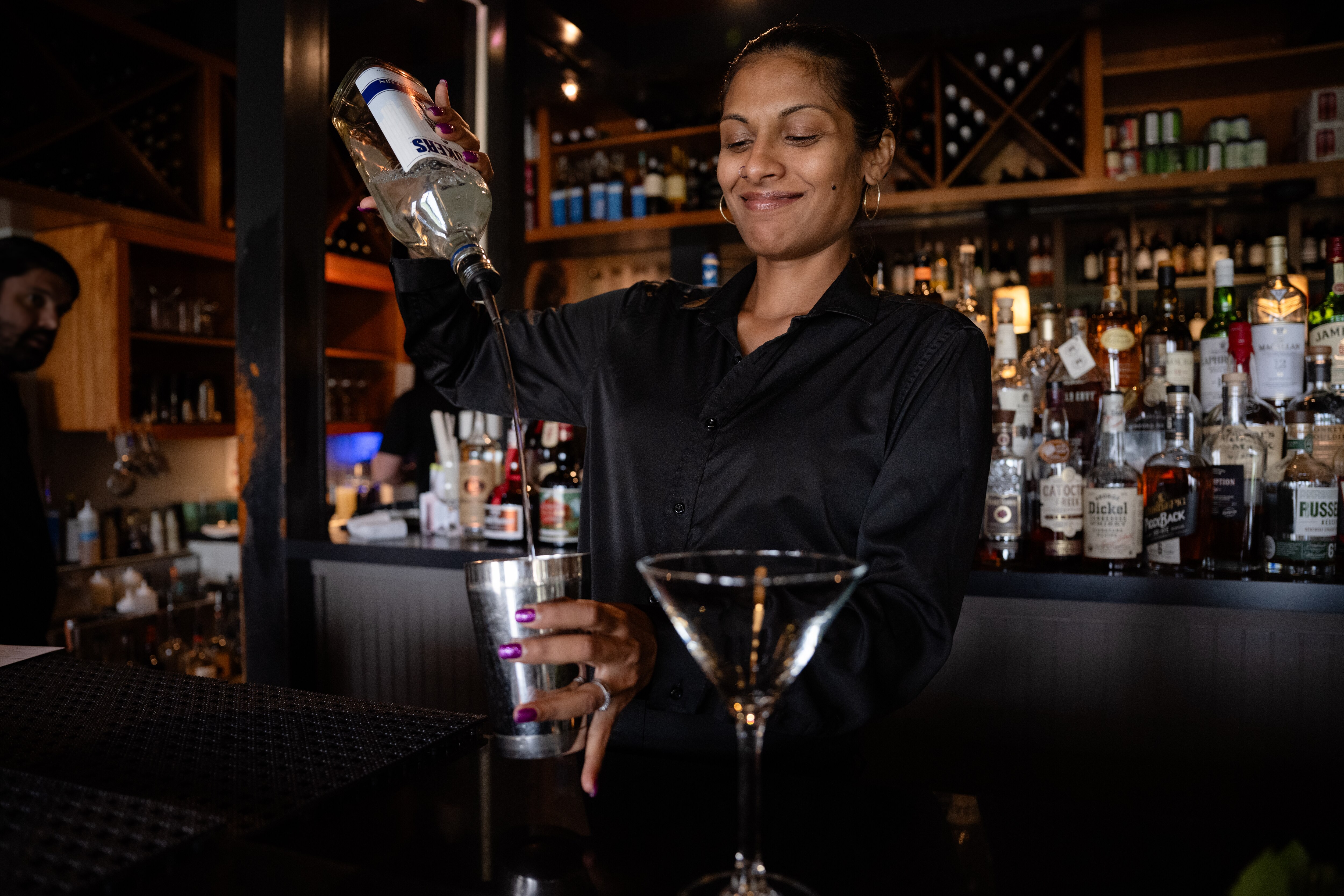 Award-winning bartender Amanda Curtis prepares a cocktail at the Iron Bridge Wine Company.