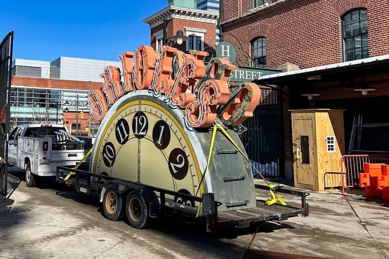 The Orioles are refurbishing the clock at Camden Yards, taking it down from the scoreboard before transporting each half for work.