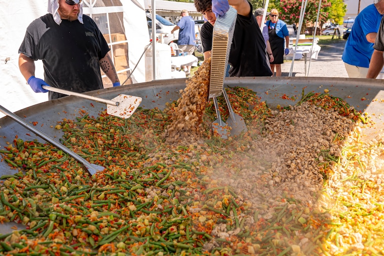 The “Wok and Roll” event features a chicken stir-fry cooked in an enormous wok, served to guests until they run out.