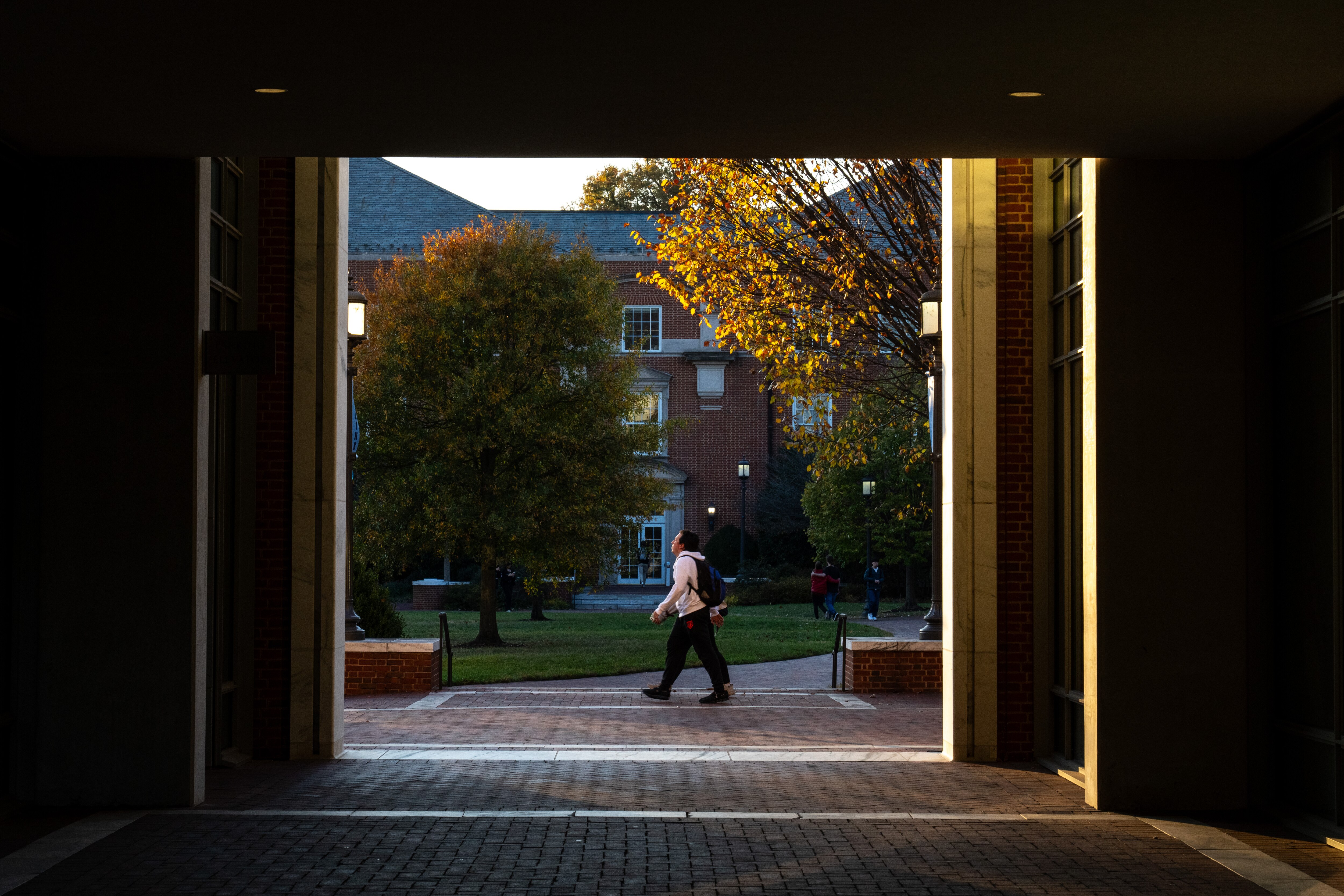 A student walks through Johns Hopkins University’s Homewood campus on Tuesday, Nov. 7, 2023.