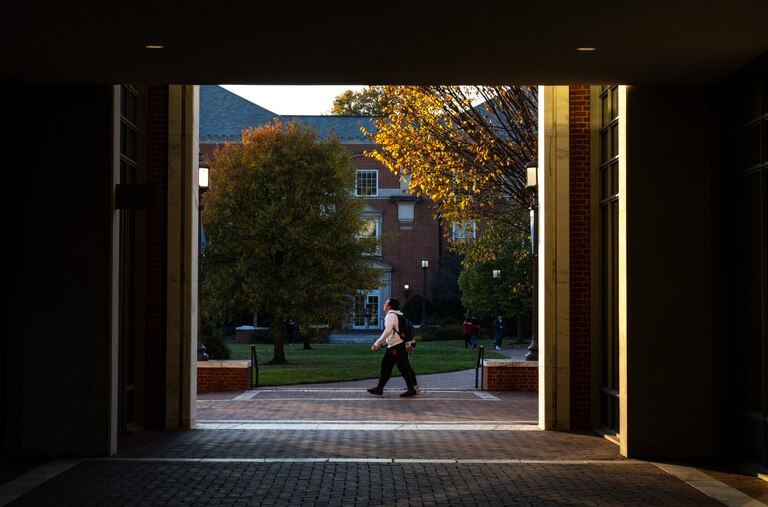 A student walks through Johns Hopkins Universityâs Homewood campus on Tuesday, Nov. 7, 2023.