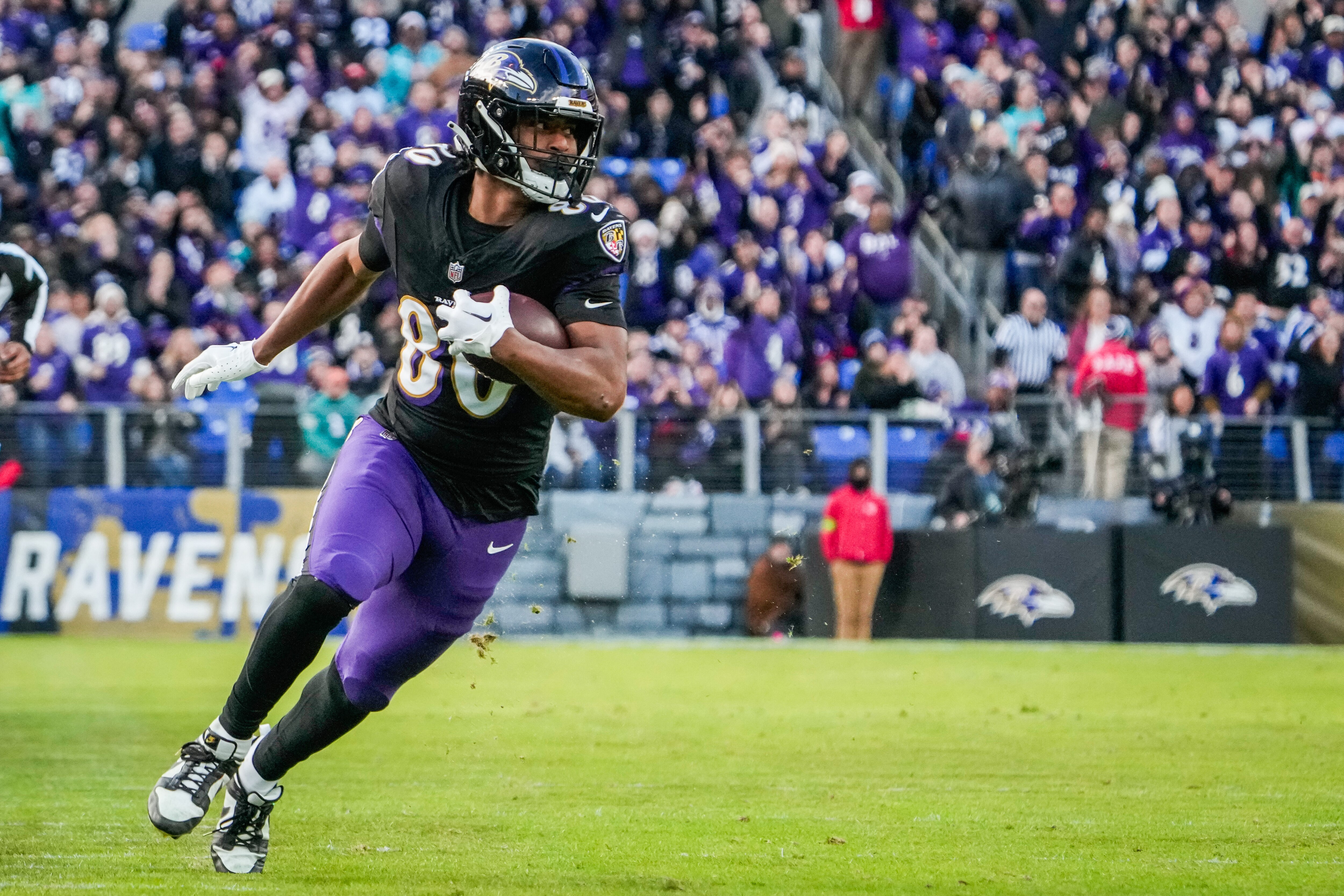 Baltimore Ravens tight end Isaiah Likely (80) runs down the field during the second quarter against the Miami Dolphins at M&T Bank Stadium on Sunday, Dec. 31, 2023.