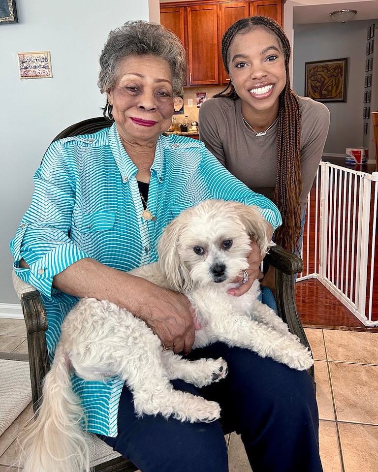 Patricia Alsobrooks with her granddaughter Alexandra and Alexandra's dog, Nico.