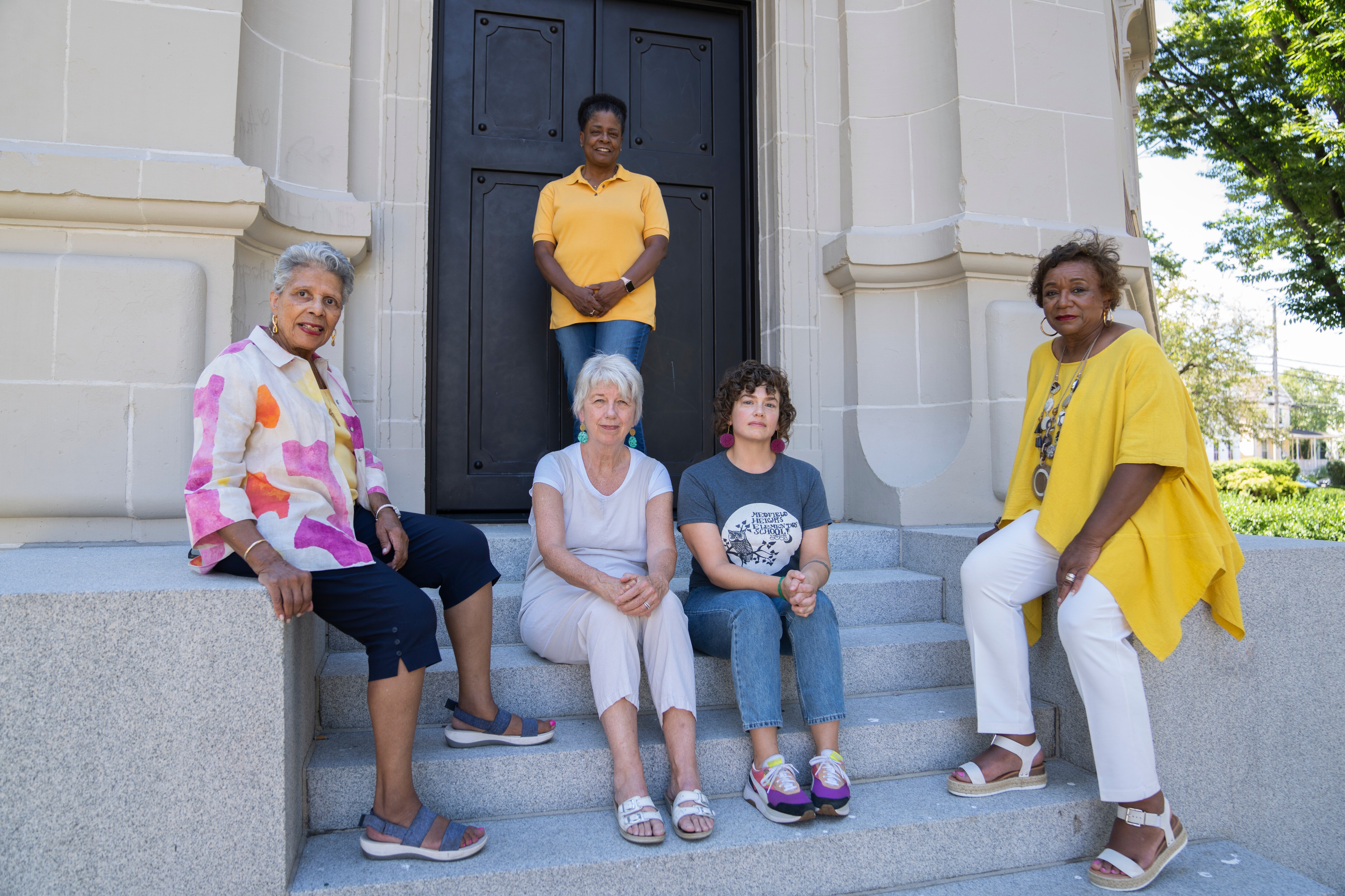 Members of the Hoes Heights Action Committee come together to adovate for the park and Roland Water Tower to honor the history of the neighborhood amidst upcoming changes.