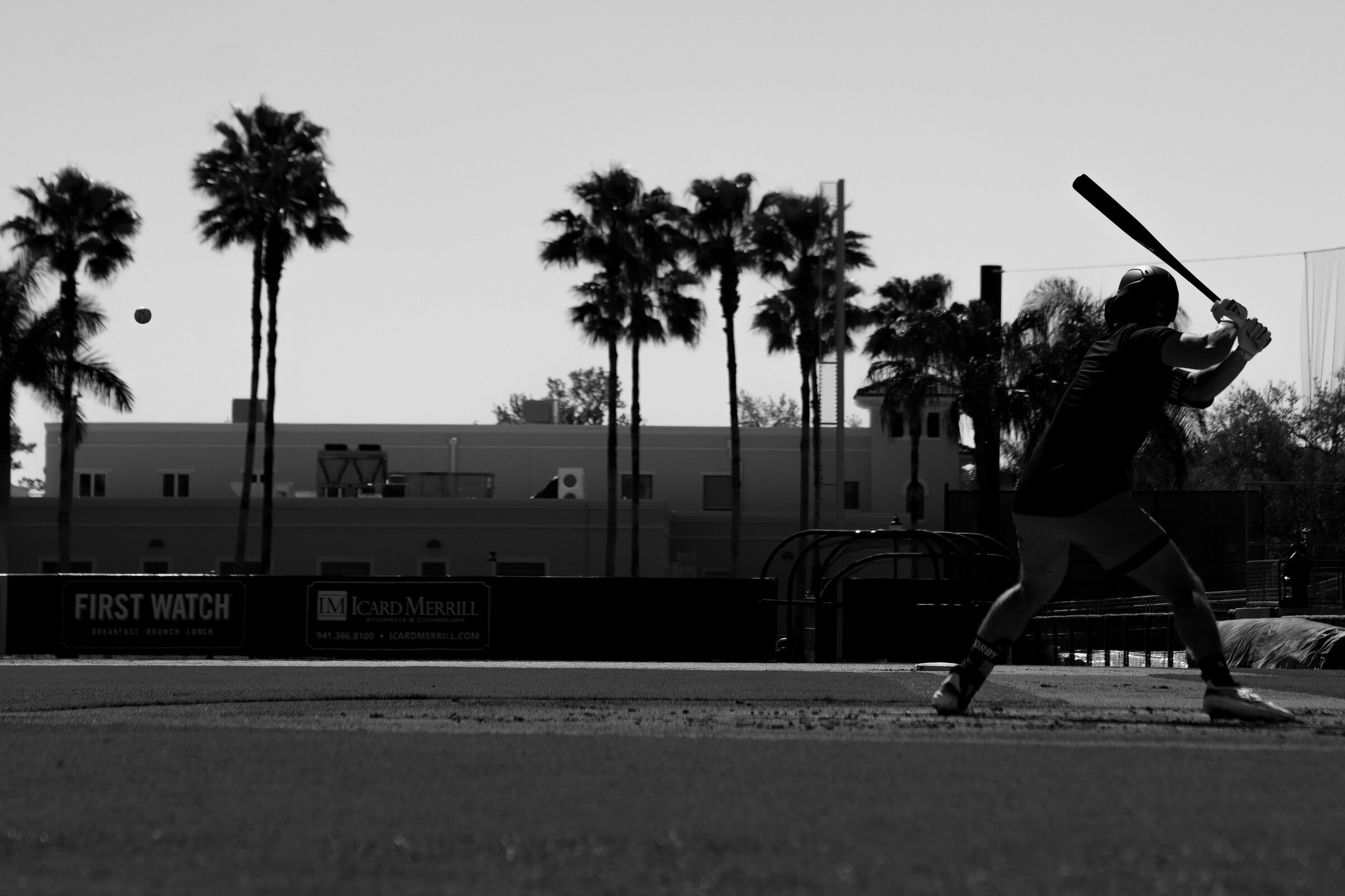 Infielder Connor Norby gets ready to swing at a pitch during batting practice at Ed Smith Stadium in Sarasota, Florida.