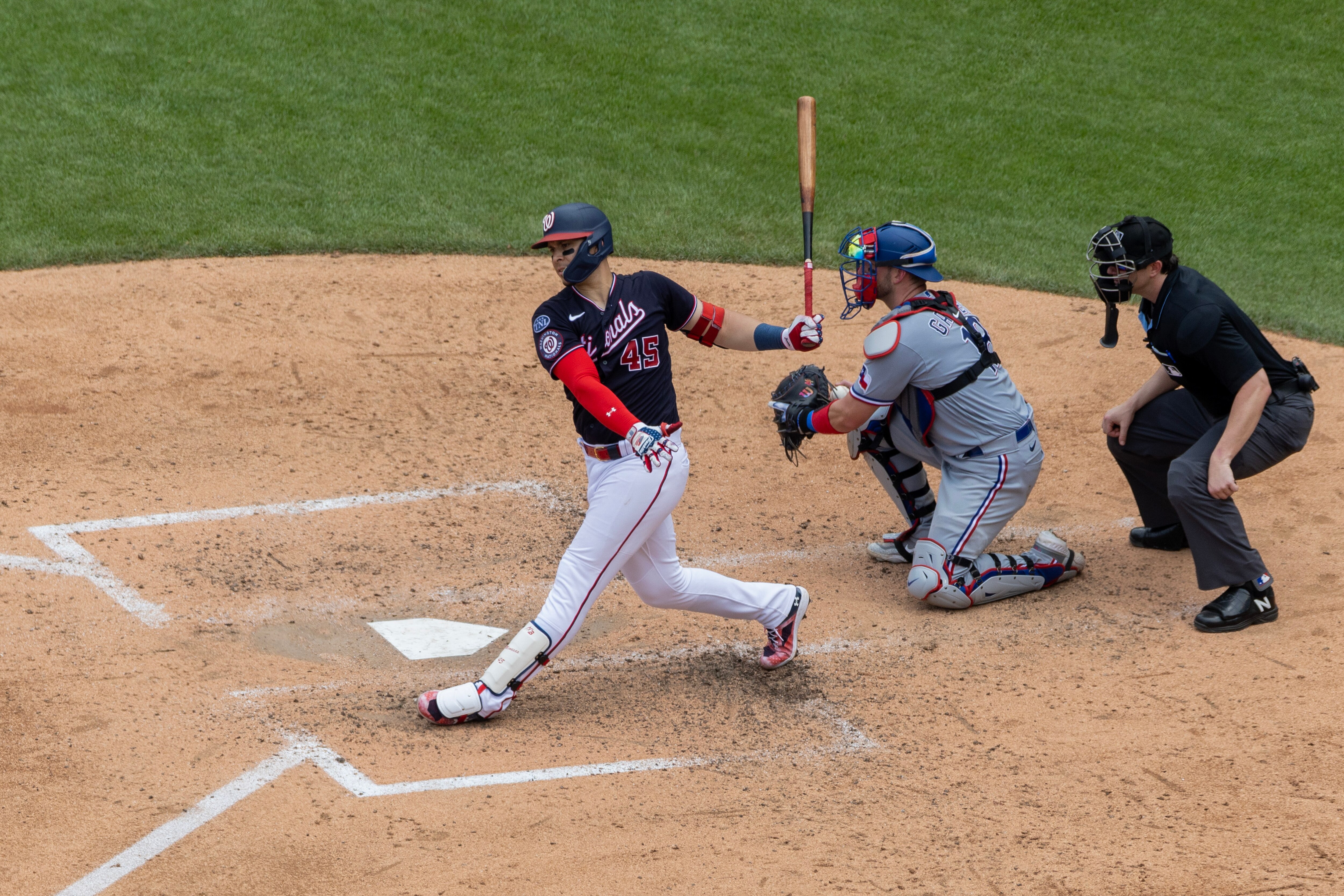 The Nationals' Joey Meneses watches his fourth home run in three games leave the park.