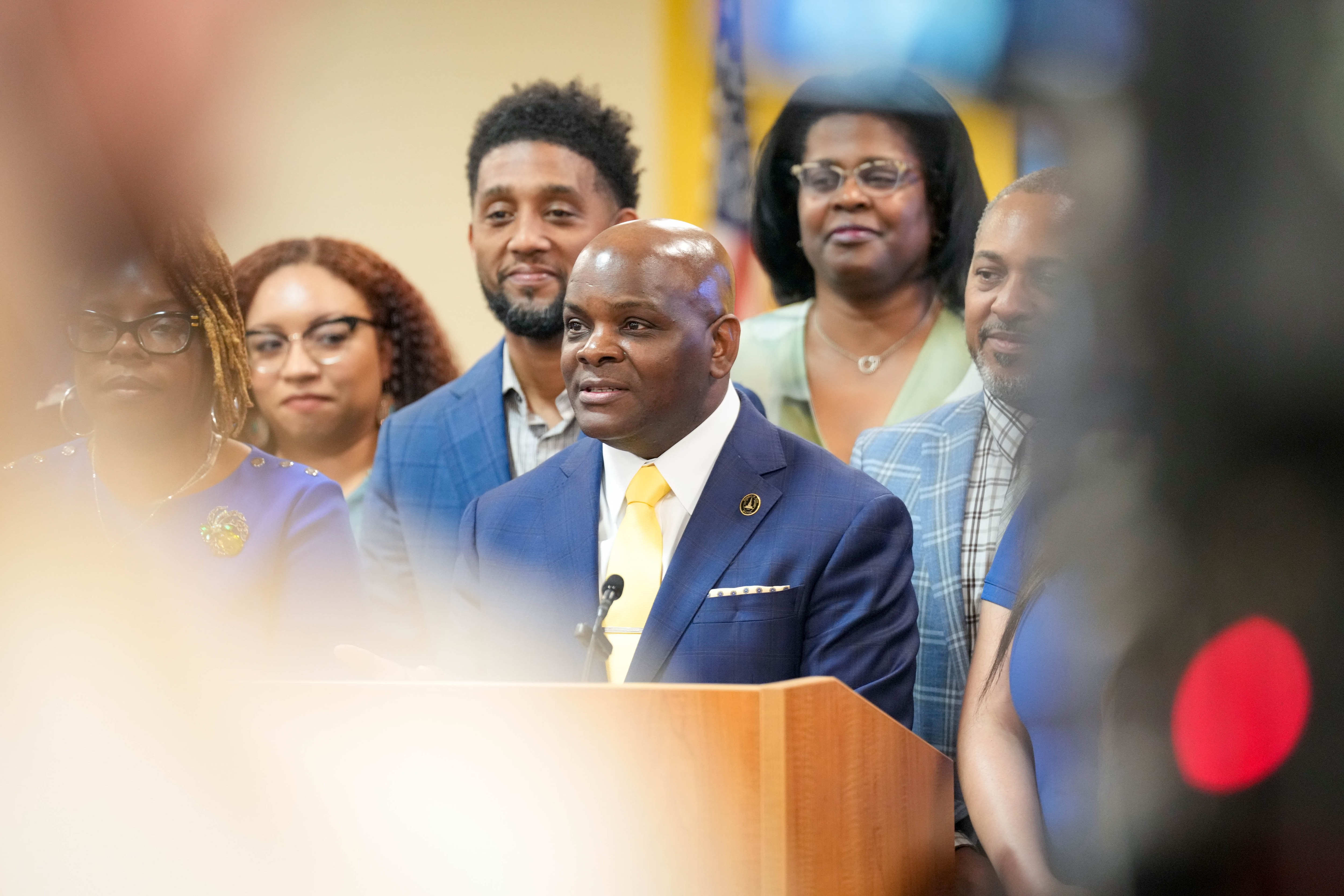 Jermaine Dawson, center, will succeed Baltimore City Public Schools CEO Sonja Santelises, right. The incoming and outgoing CEOs appeared together at a school board meeting announcing Dawson as the new hire. 