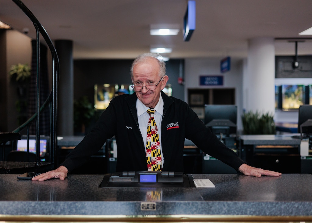 Dave Turowski, 70, helps guests place bets at Laurel Park Race Track. Turowski first came to the track when he was young with his stepfather, and later, in 1979, began working at Laurel. The biggest thing he’s noticed change in horse racing is technology, noting that machine betting and simulcasting has resulted in a loss of in-person customers and jobs.
