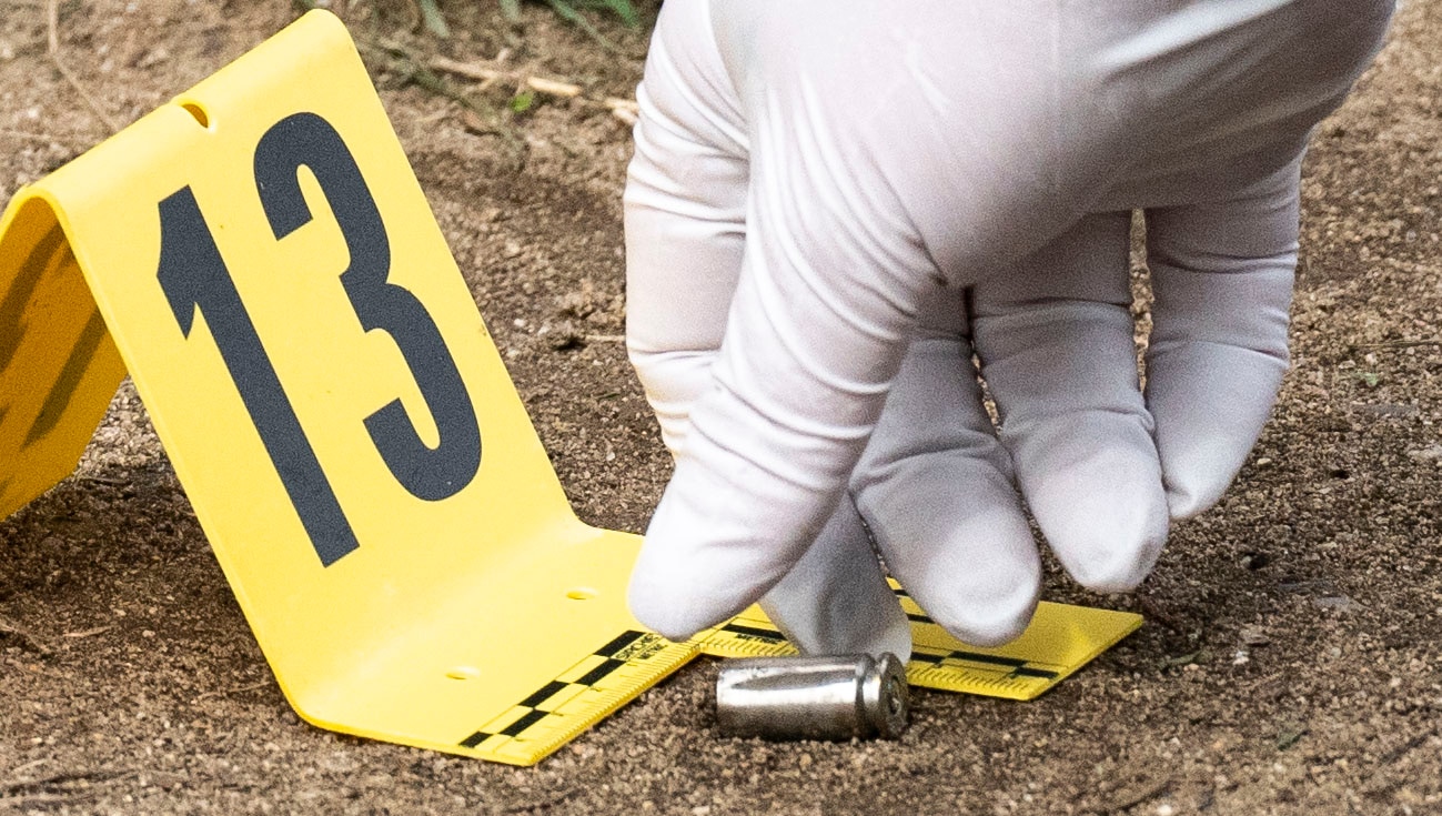Baltimore Police mark cartridge casings in Brooklyn Homes following a mass shooting that killed two people and injured 28 others during an annual celebration on July 2, 2023. Aaliyah Gonzalez, 18, was pronounced dead at the scene. Kylis Fagbemi, 20, died at a hospital.