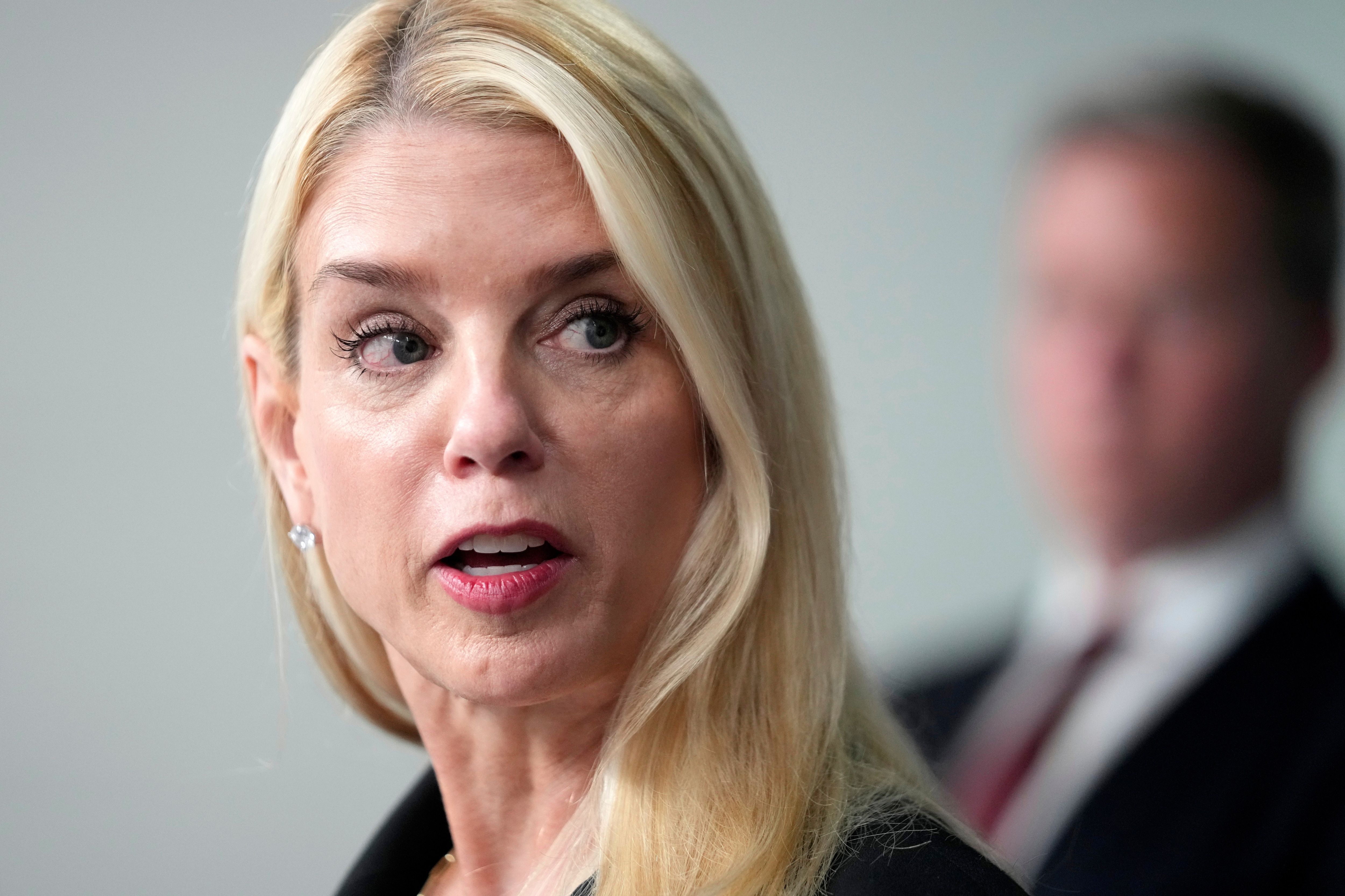 Attorney General Pam Bondi speaks with reporters during a briefing with President Donald Trump in the James Brady Press Briefing Room at the White House, Monday, Aug. 11, 2025, in Washington. (AP Photo/Mark Schiefelbein)