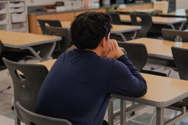 An undocumented student sits in his math classroom after school in Baltimore, Md.