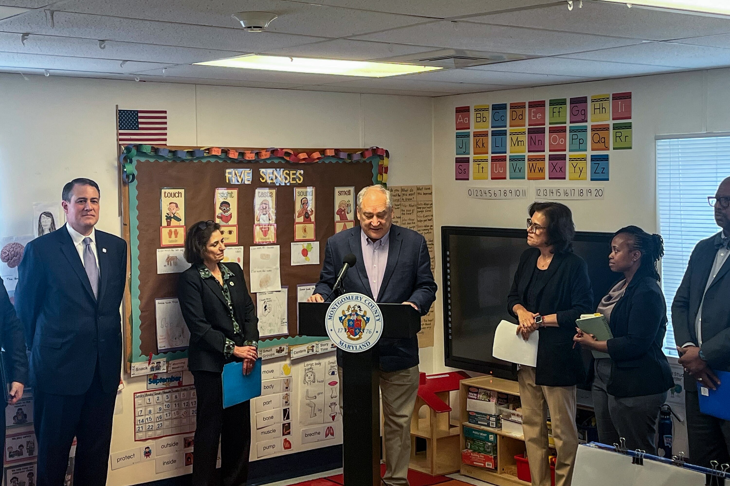 County Executive Marc Elrich is joined by other Montgomery County leaders as they tout a plan to expand early childhood education access while at the Academy Child Development Center in North Potomac on Wednesday.