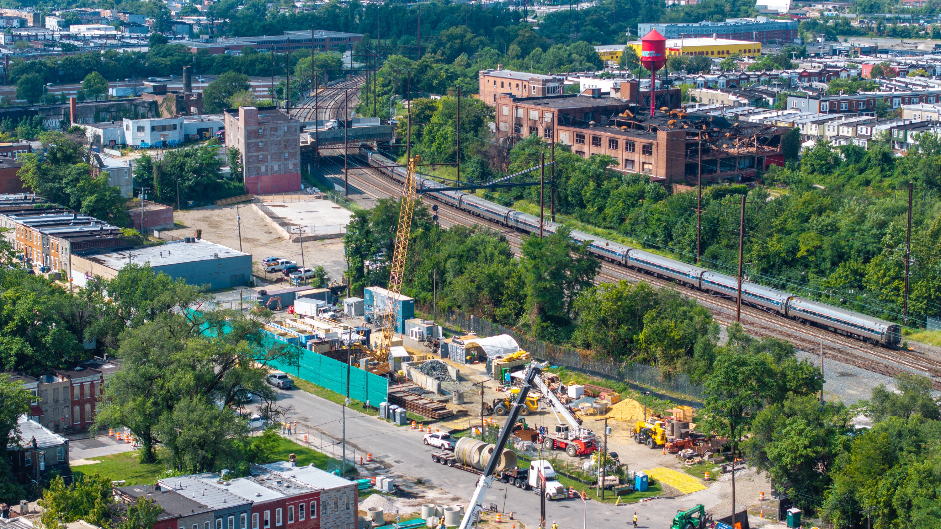 Thursday, Aug. 14, 2025 — A MARC train passes the construction site for Amtrak's Frederick Douglass Tunnel in West Baltimore.