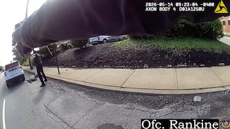 In a still from released body camera footage, Baltimore Police officers opened fire on the Louis Jackson, who had run at Officer Sharod Watson and fired a revolver at him during an apparent mental health crisis.