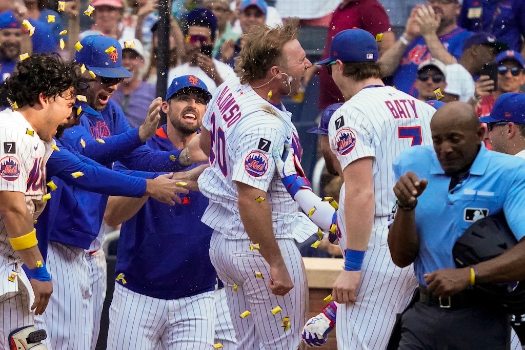 NEW YORK, NEW YORK - SEPTEMBER 14: Pete Alonso #20 of the New York Mets heads to home plate to celebrate with teammates after hitting a home run for a walk off win in the bottom of the 10th against the Texas Rangers at Citi Field on September 14, 2025 in New York City. The New York Mets won 5-2.