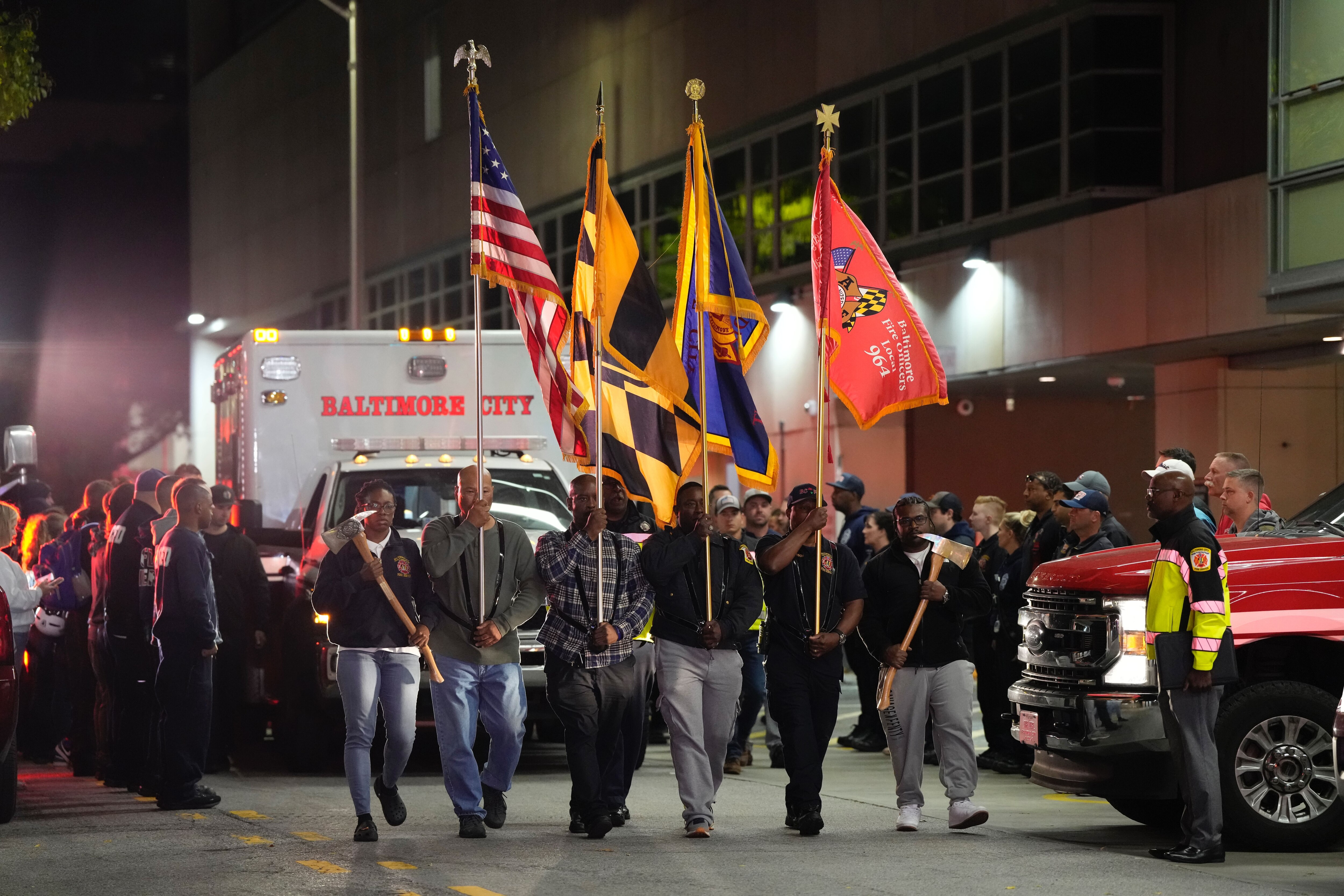 Firefighters gathered in Baltimore after a fatal fire in the Northwest district. Three firefighters were hospitalized after battling a blaze.