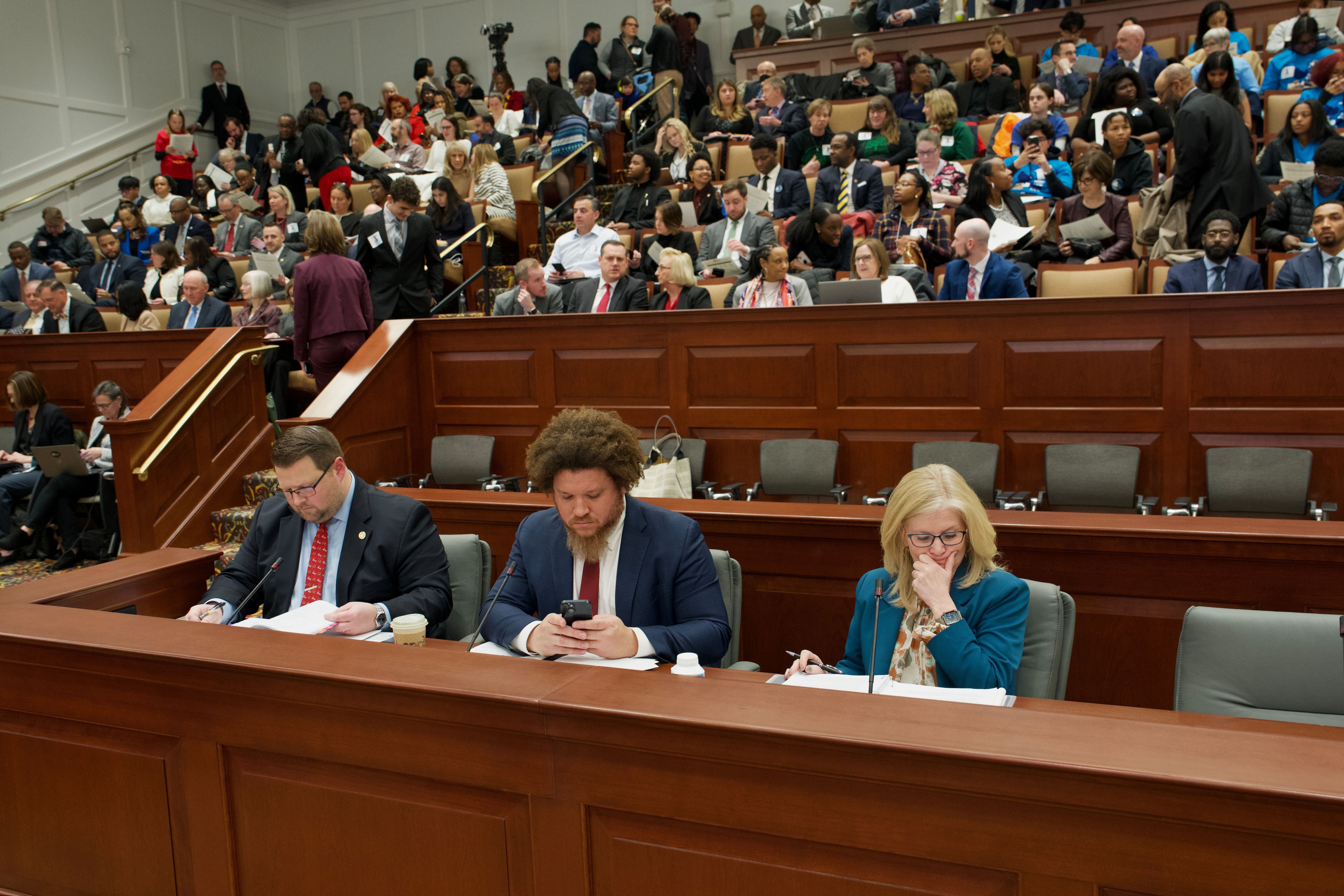 From left, Mike Thomas, a member of the Gov. Wes Moore’s legislative team, Fagan Harris, Chief of Staff for Gov. Wes Moore, and Carmel M. Martin, Special Secretary for the Governor's Office for Children, at a joint bill hearing for the Excellence in Maryland Public Schools Act in Annapolis on Wednesday.
