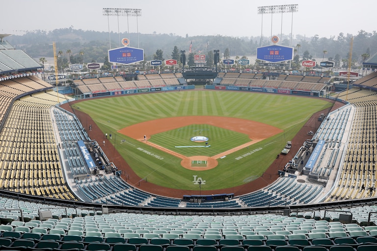 Dodger Stadium is shrouded in haze due to smoke from a warehouse fire in the Los Angeles neighborhood of Boyle Heights, Sunday, June 21, 2026. (AP Photo/Caroline Brehman)
