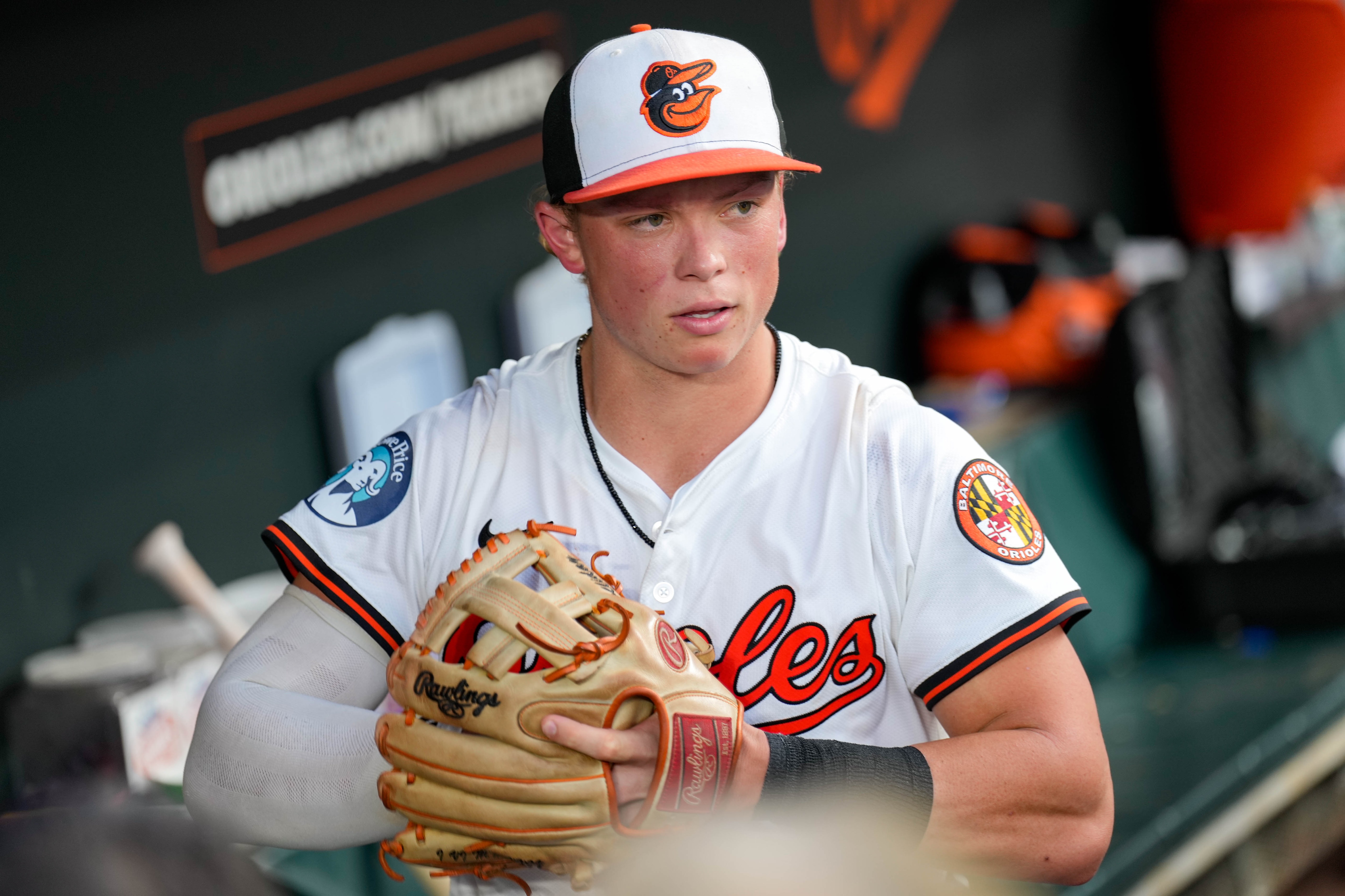 Baltimore Orioles second base Jackson Holliday (7) puts his glove on to return to the field during a game against the Texas Rangers at Orioles Park at Camden Yards in Baltimore, Md. on Monday, June 23, 2025.
