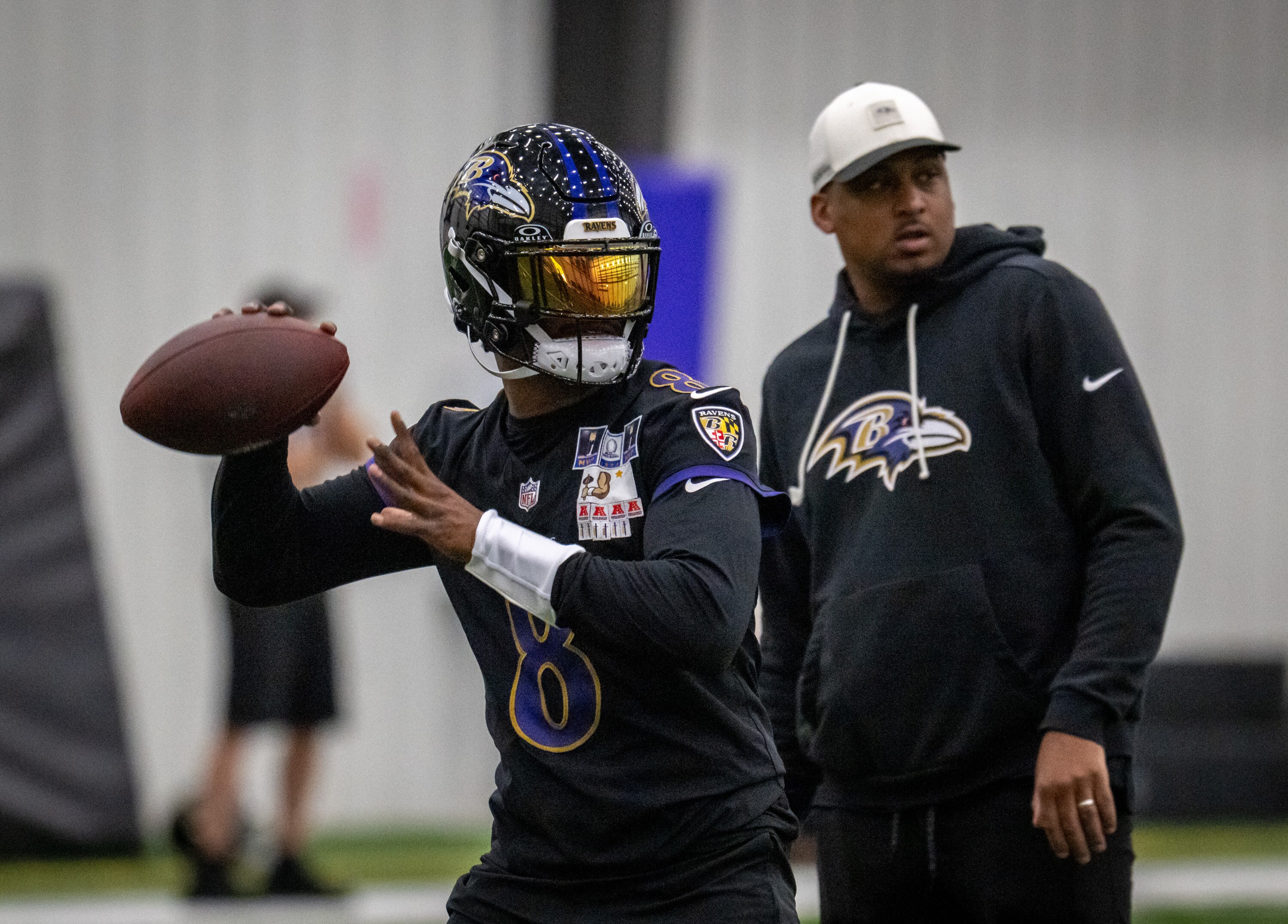 Baltimore Ravens quarterback Lamar Jackson runs through drills during the Ravens’ second OTA last month.