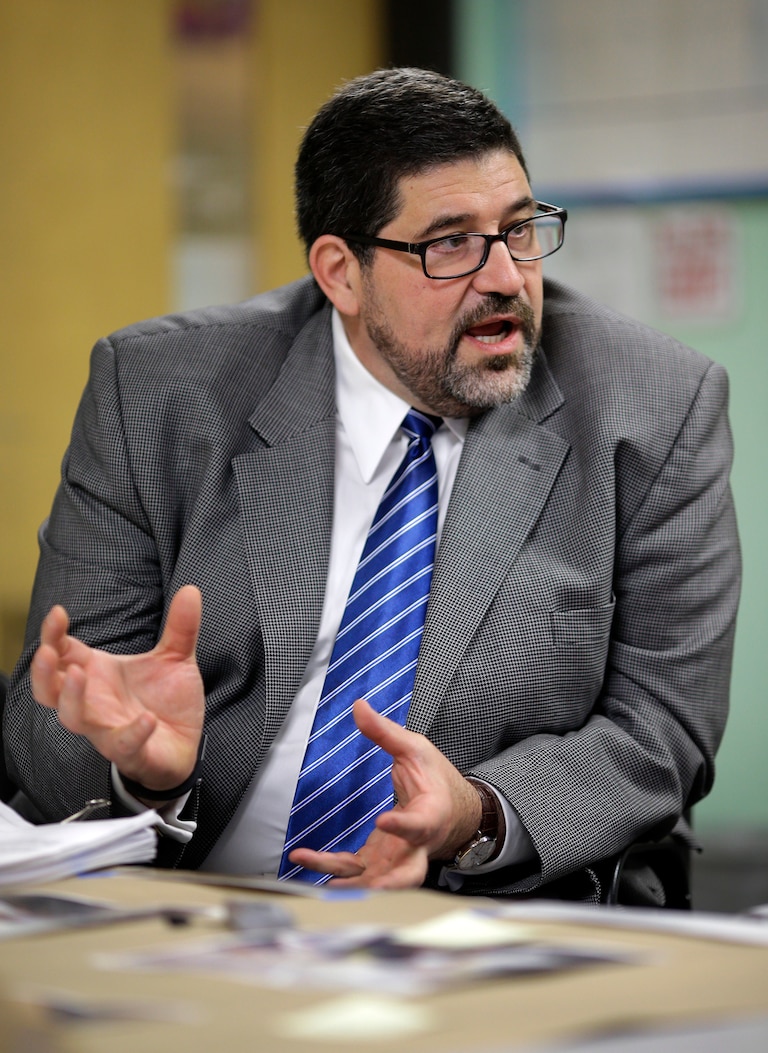 In this April 30, 2013 picture, Baltimore City Public Schools CEO Andrés Alonso speaks during an interview with The Associated Press at John Eager Howard Elementary School in Baltimore. The school district announced Monday that Alonso will retire at the end of the current school year after six years of leading the school district. Officials say his retirement is fueled by his desire to return home to New Jersey to care for his aging parents and to assume a professorship at Harvard University. (AP Photo/Patrick Semansky)