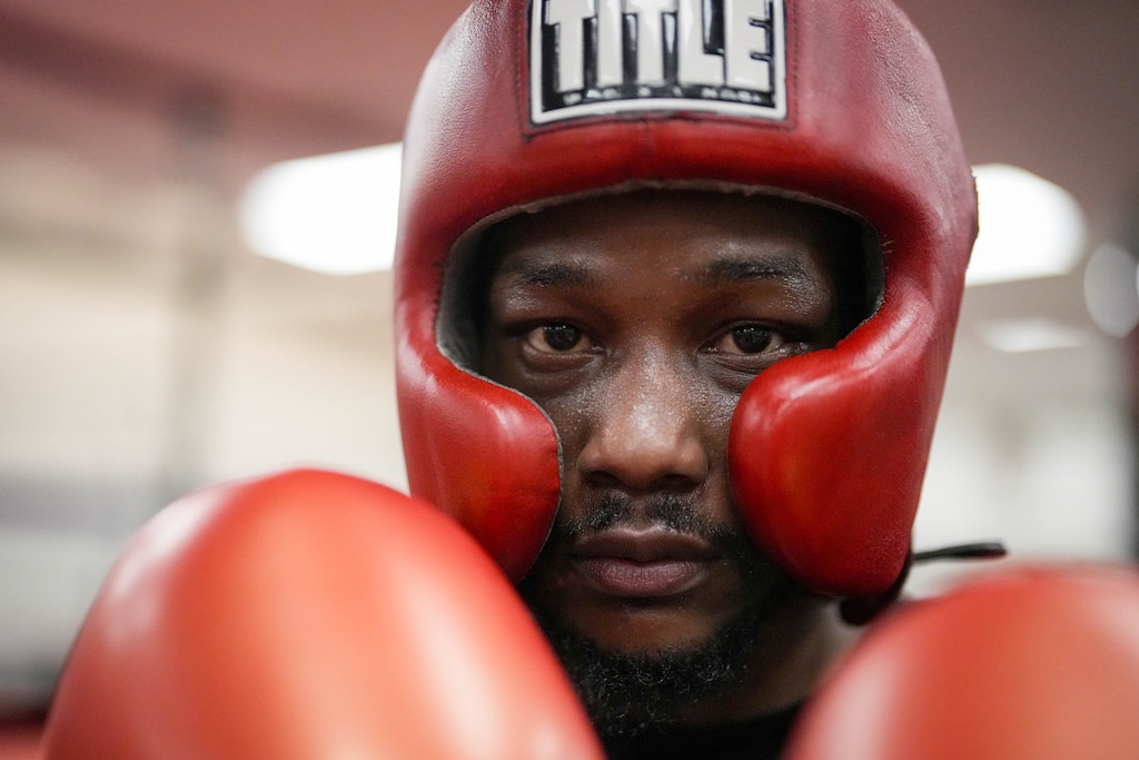 Boxer Antonio Dunton-El looks into the camera before entering the ring at the Mack Lewis Boxing Gym in Baltimore, Md. on Tuesday, April 14, 2026.