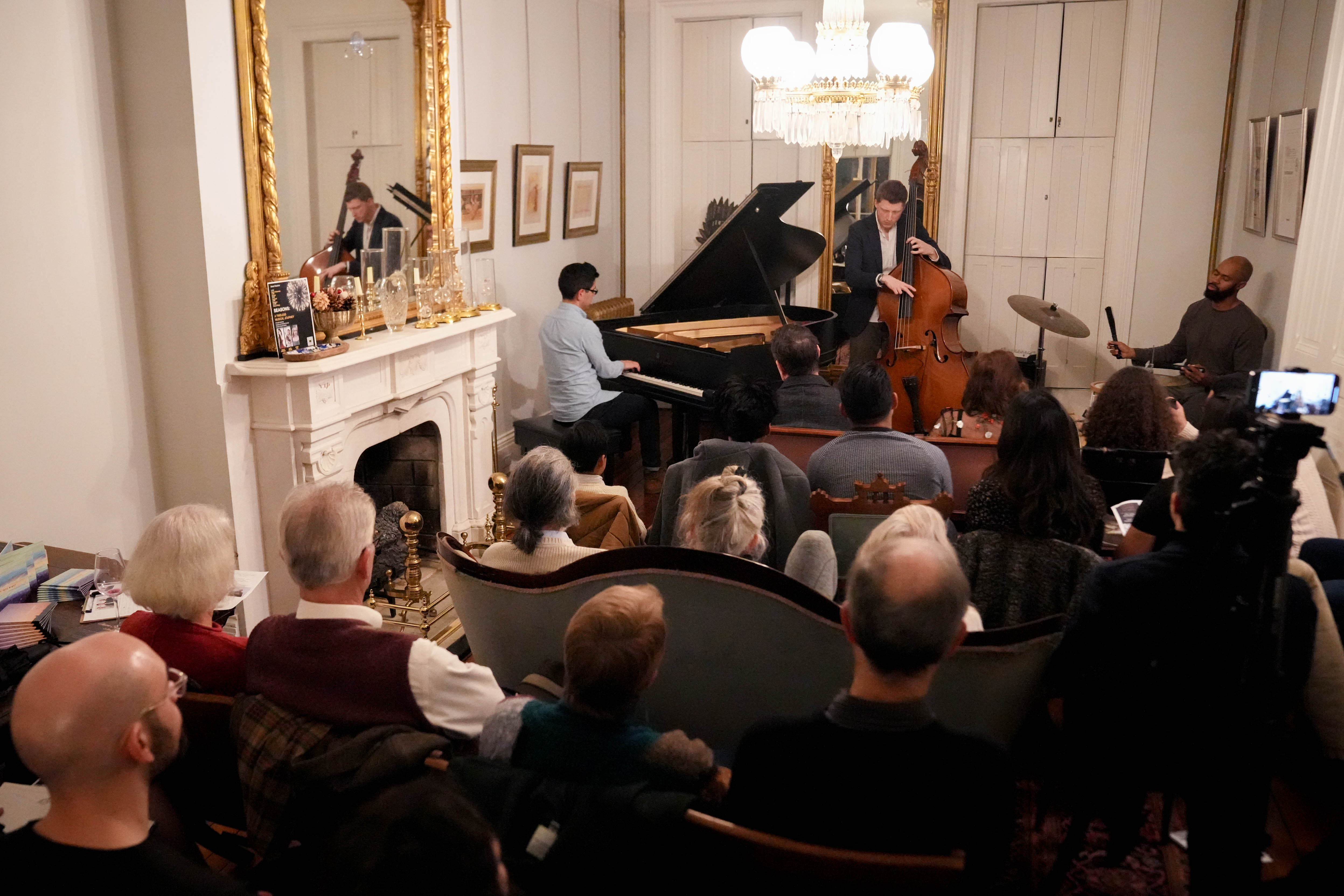 Attendees listen as the Joshua Espinoza Trio performs during a Union Square Soiree in Baltimore last month.