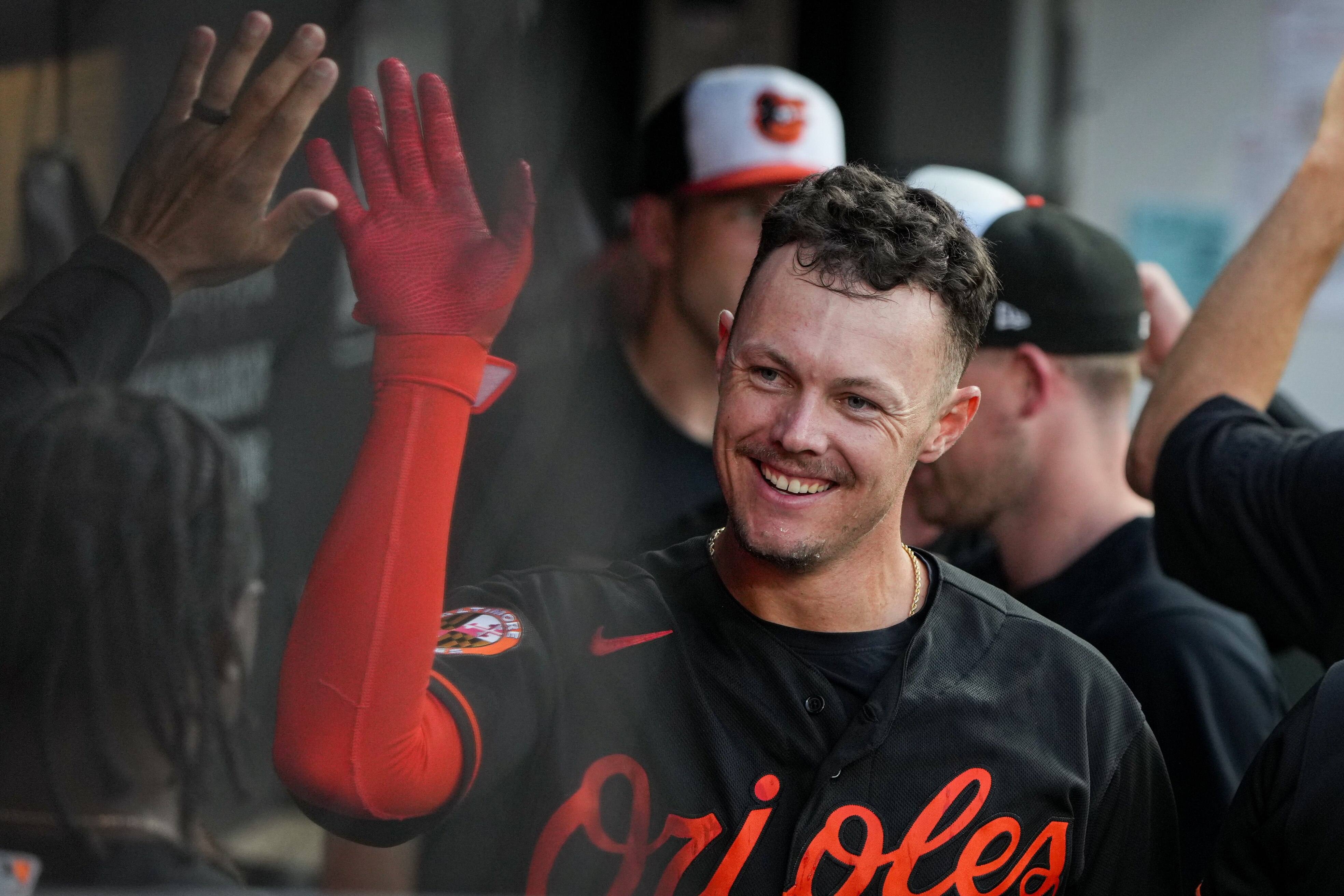 Baltimore Orioles first baseman Ryan Mountcastle (6) high fives teammates after hitting a home run in the first inning of a baseball game against the Houston Astros at Oriole Park at Camden Yards in Baltimore on Aug. 8, 2023.