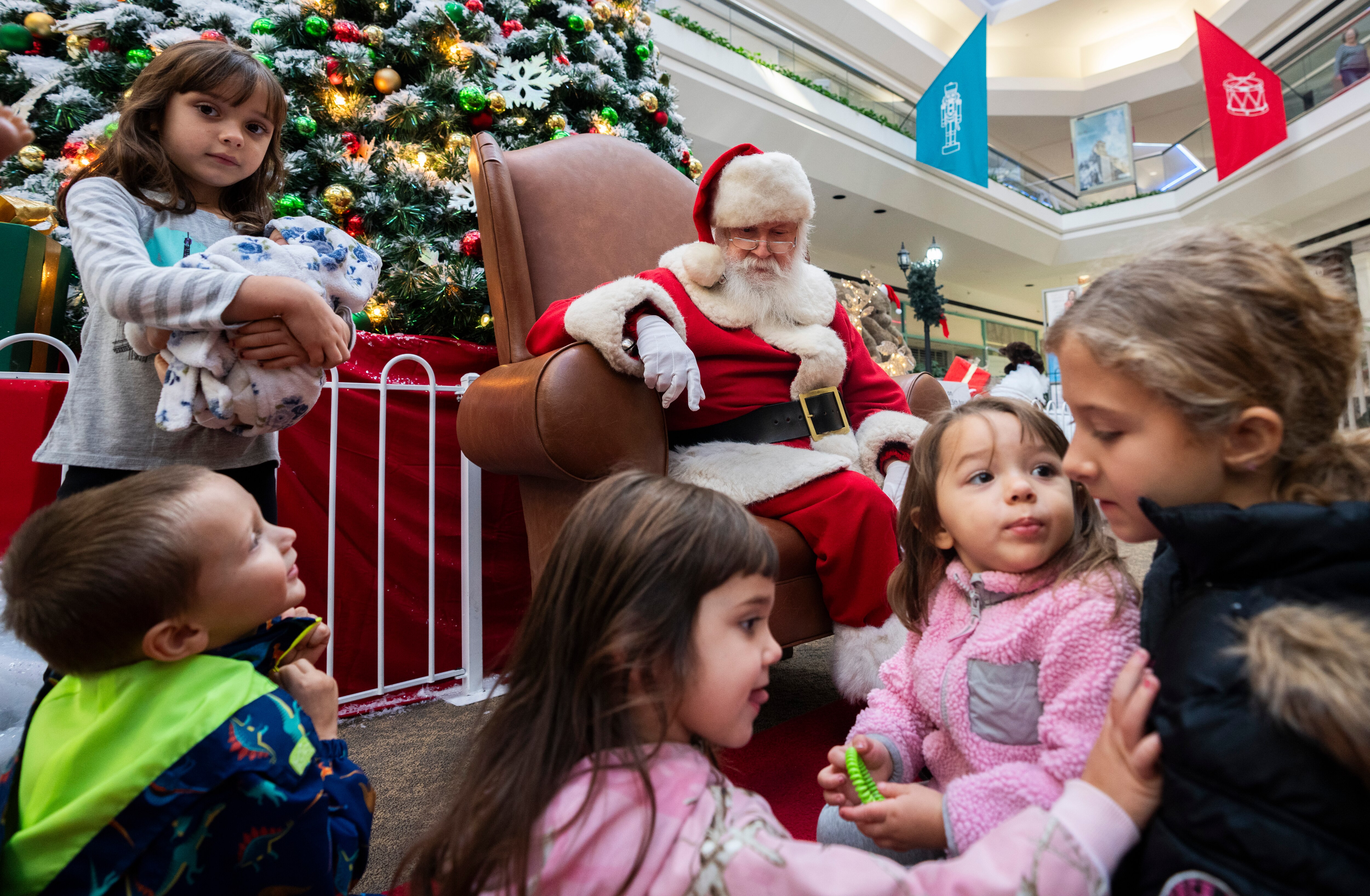 Santa Wayne has been the mall Santa at Marley Station Mall for 35 years - nearly as long as the mall has been open. With much of the mall vacant, Santa Wayne has seen hardly any children this year.  To his excitement, the Shelley family came to see him. The children's grandmother used to take their mother to see him when she was a girl.