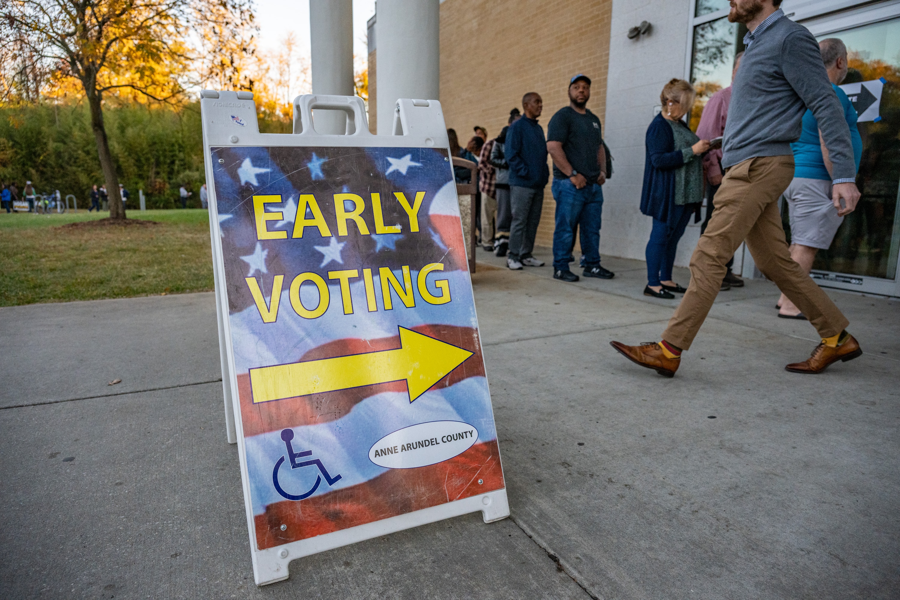 Voters line up outside the Odenton Public Library Thursday, October 31, 2024, on the last day of early voting in the general election.