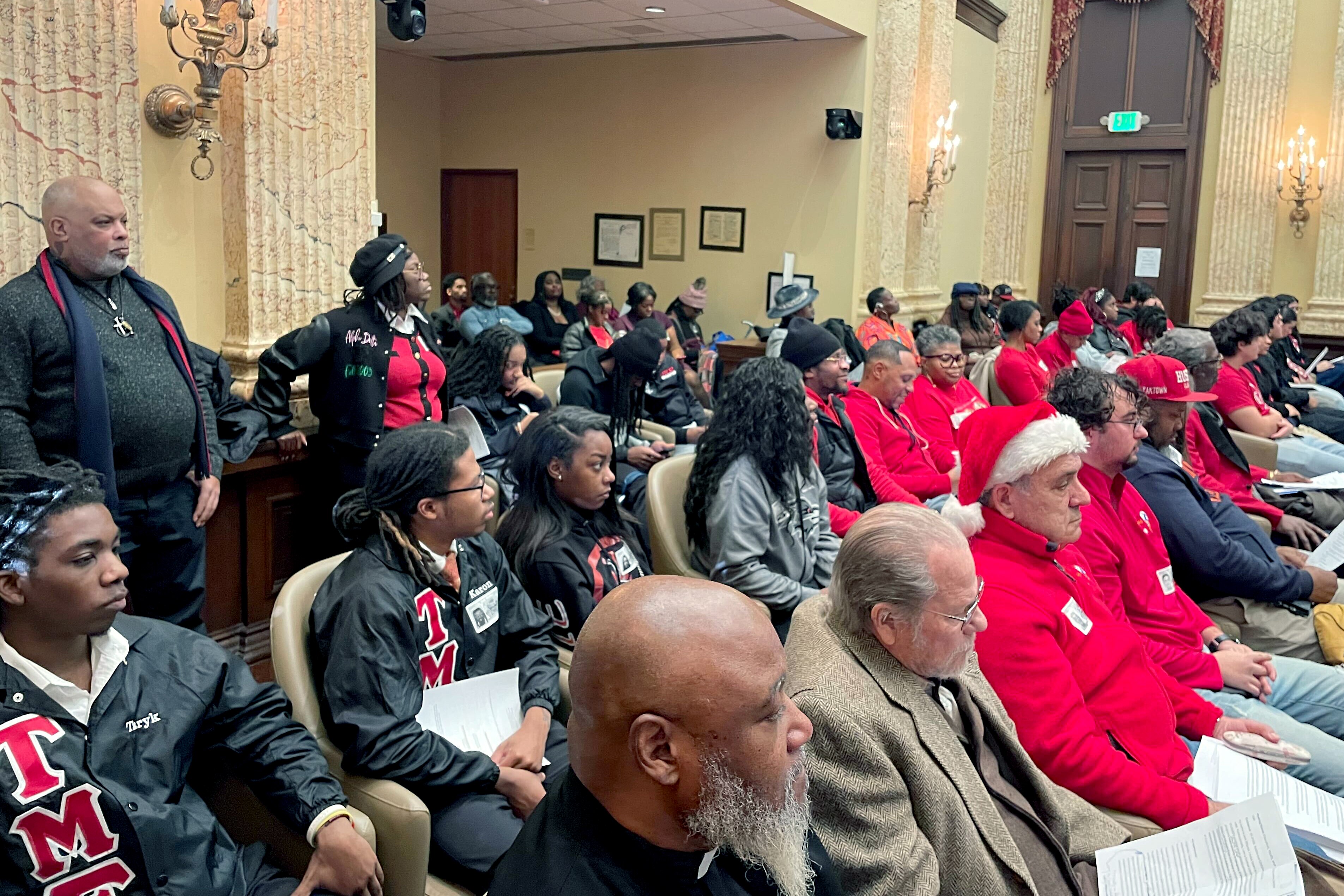 THURSDAY, DECEMBER 18, 2025 - Supporters of the Baltimore Children and Youth Fund, many wearing red, pack Baltimore City Council chambers Thursday to testify against legislation that would place new restrictions on the fund.