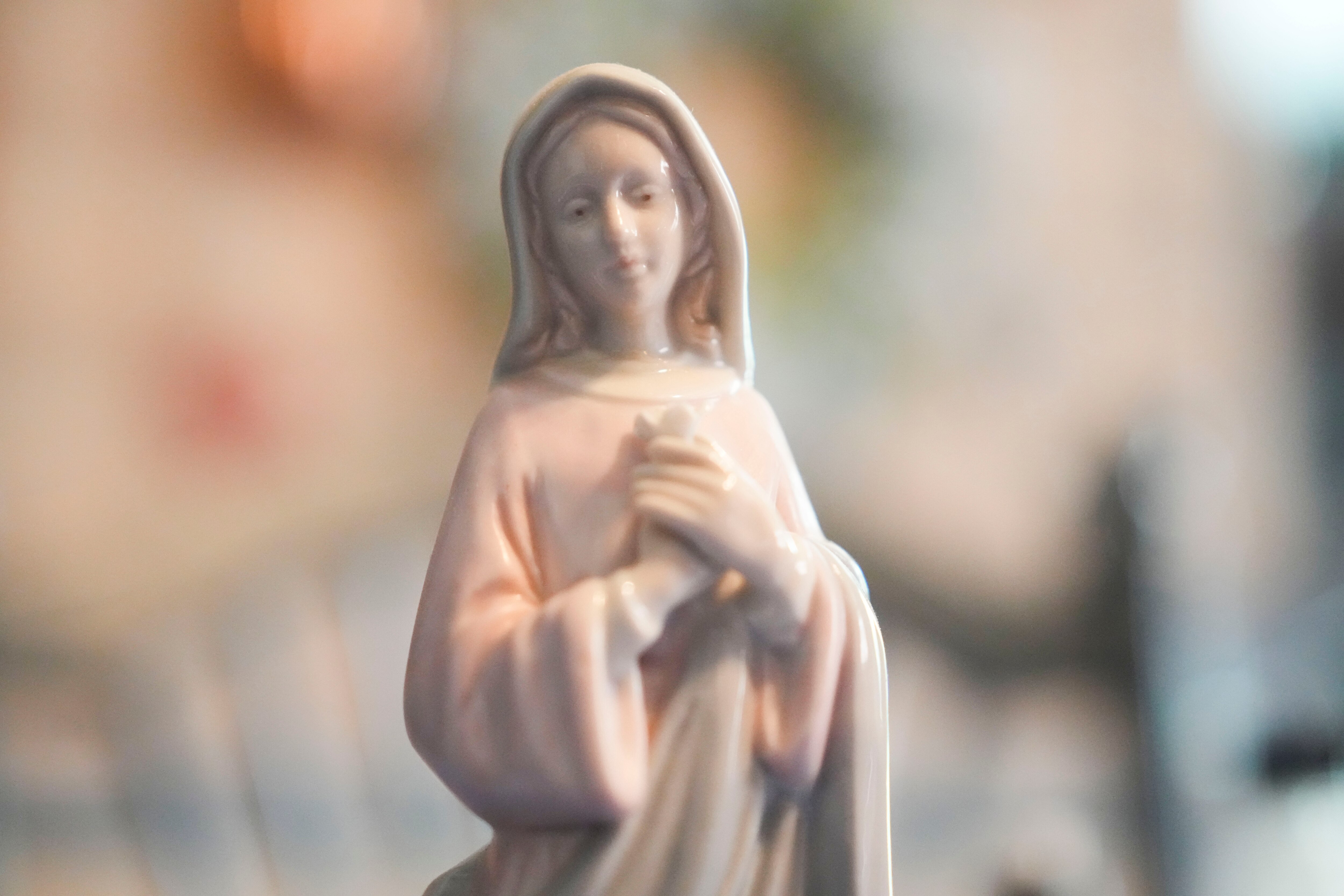 Mary Jo Rogers pictured in her home on May 23, 2023 with her religious artifacts many of which are family heirlooms. Rogers says she feels betrayed by the church and can't go back. She still has her Catholic faith but it is seperate from the insitution.