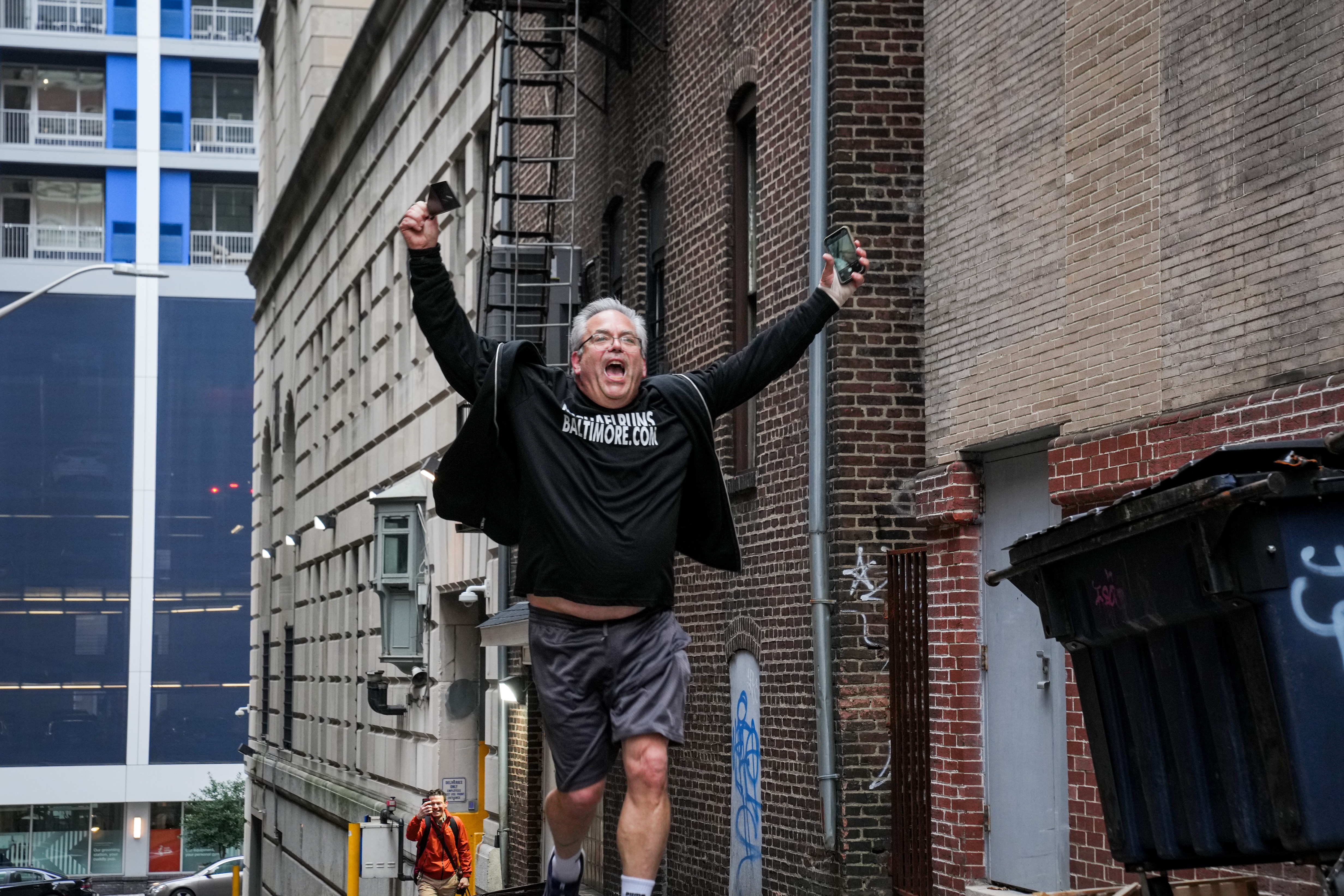 Michael Lisicky runs up Dark Lane in downtown Baltimore on Feb. 12, 2024. For the last eight months, Lisicky has been working to complete his goal of running on every street in Baltimore.