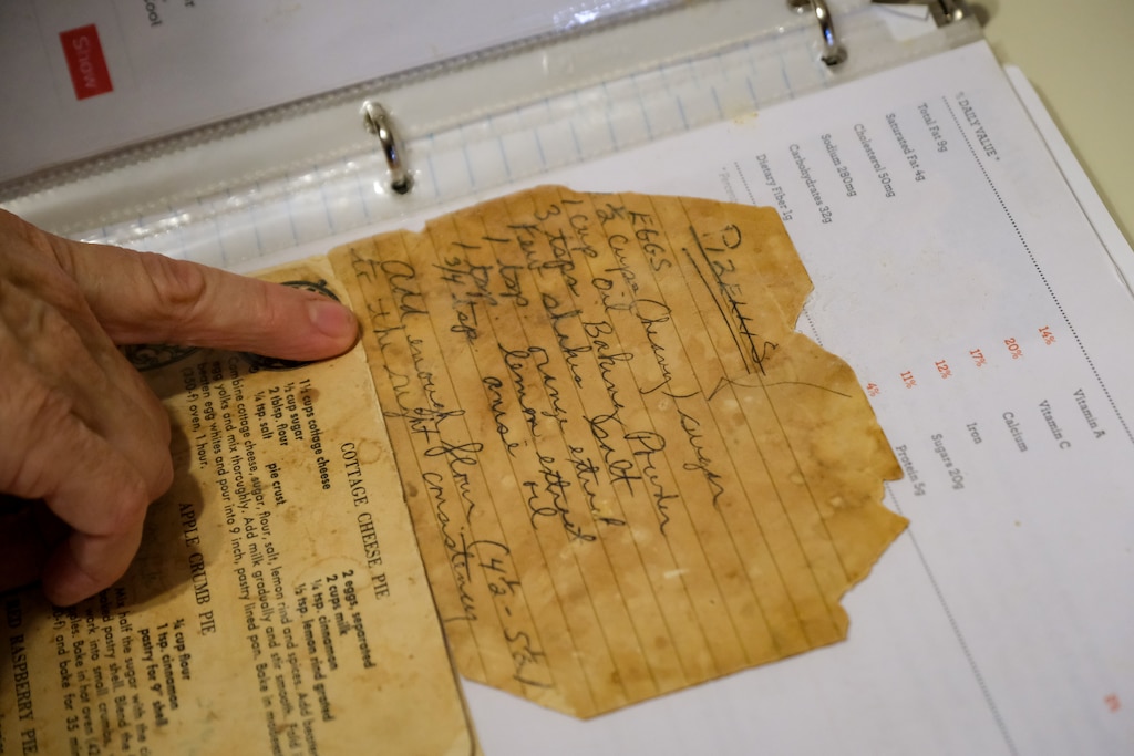 Beth Rannie consults her mother’s recipe for pizzelles. Even after years of baking the cookies for Thanksgiving, Rannie still likes to keep the recipe close.