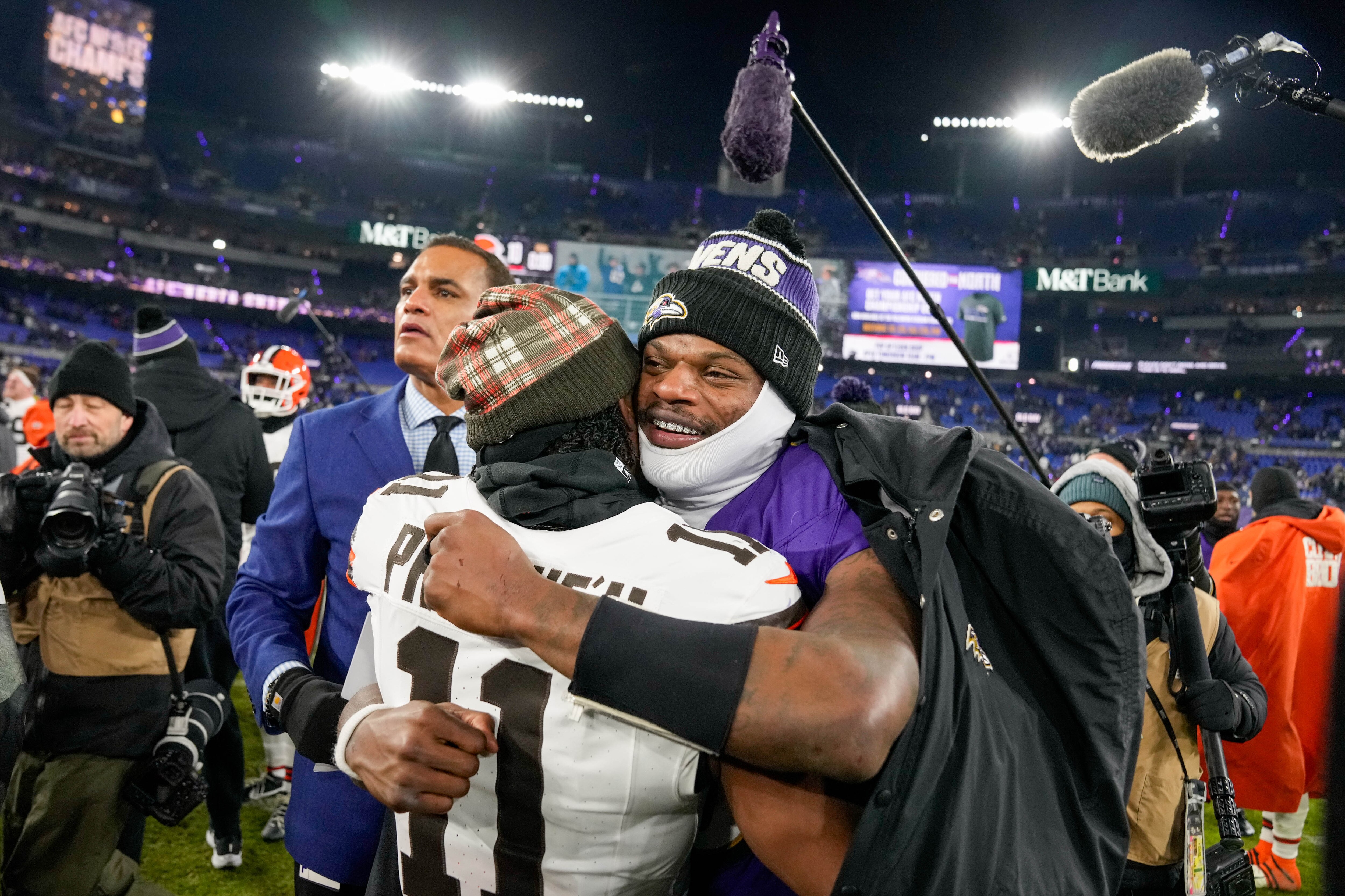 Baltimore Ravens quarterback Lamar Jackson (8) greets other players in the field after winning a game against the Cleveland Browns at M&T Bank Stadium in Baltimore, Md. on Saturday, January 4, 2025.
