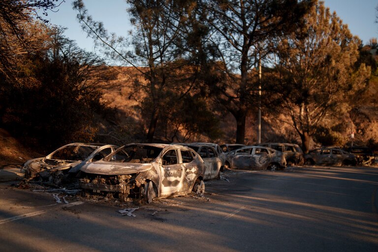 Destroyed cars are seen in the Pacific Palisades neighborhood of Los Angeles, California.