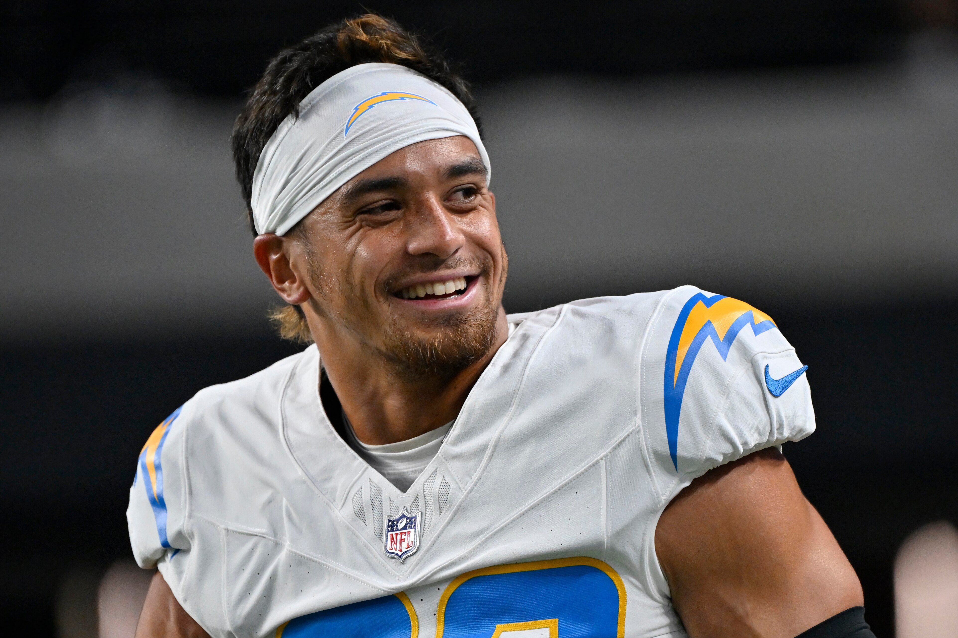 Safety Alohi Gilman looks on before an NFL football game between the Los Angeles Chargers and Las Vegas Raiders.