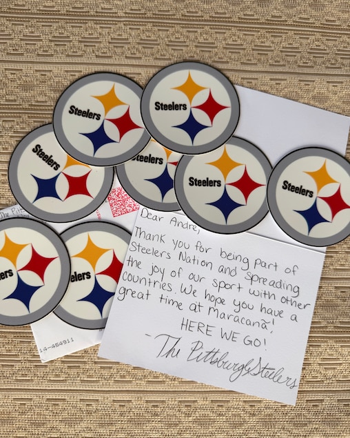 Andre Suman received merchandise from various NFL teams to take to the NFL games in Brazil to hand out for free.