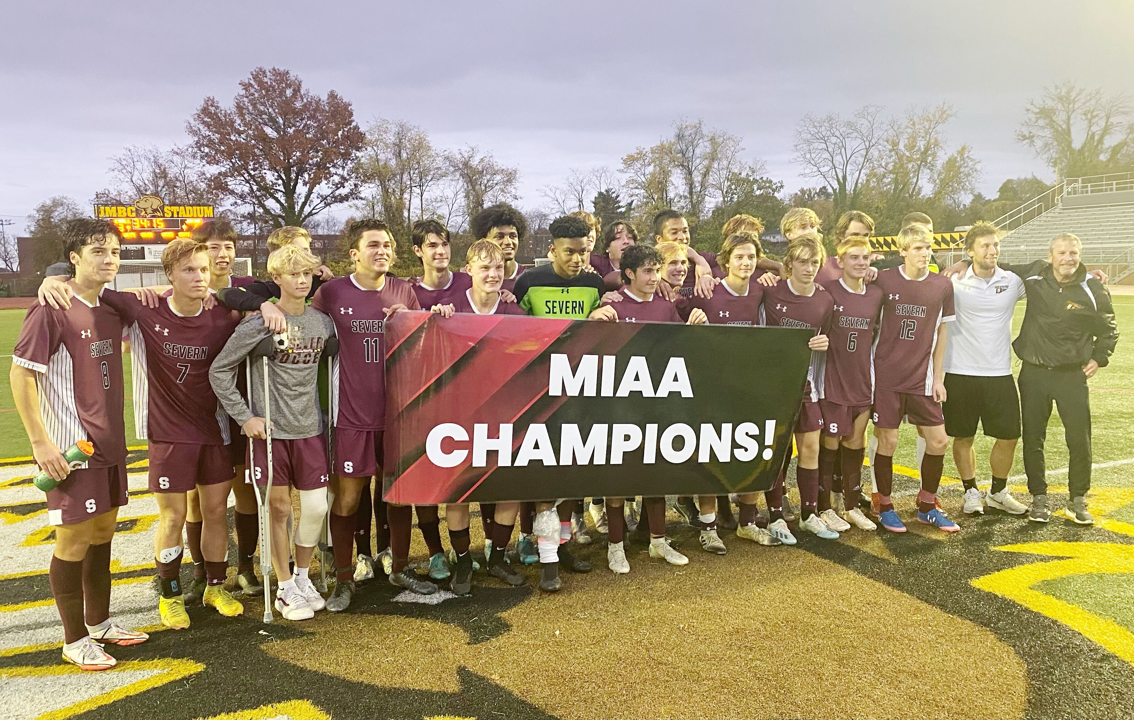 The Severn Admirals pose with a banner that proclaims their second straight MIAA B Conference soccer championship.