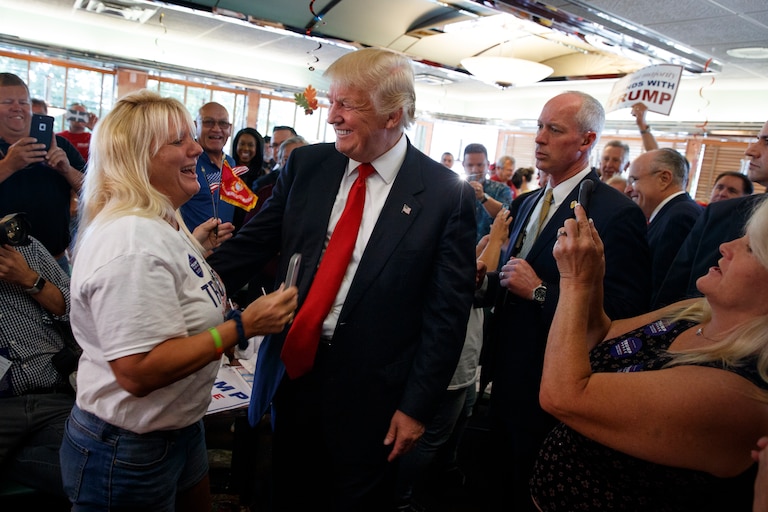Tracy McCullough, of Dundalk, Md., talks with Republican presidential candidate Donald Trump during a visit to the Boulevard Diner, Monday, Sept. 12, 2016, in Dundalk, Md. (AP Photo/Evan Vucci)