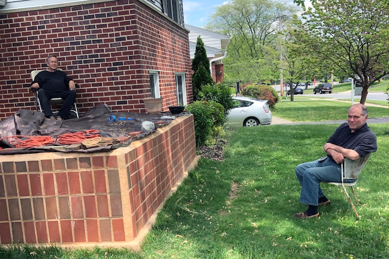 Alan Courduff, left, and Bob Kneebone practicing COVID distancing at Alan's home in 2021. The front porch which was his last completed home improvement.