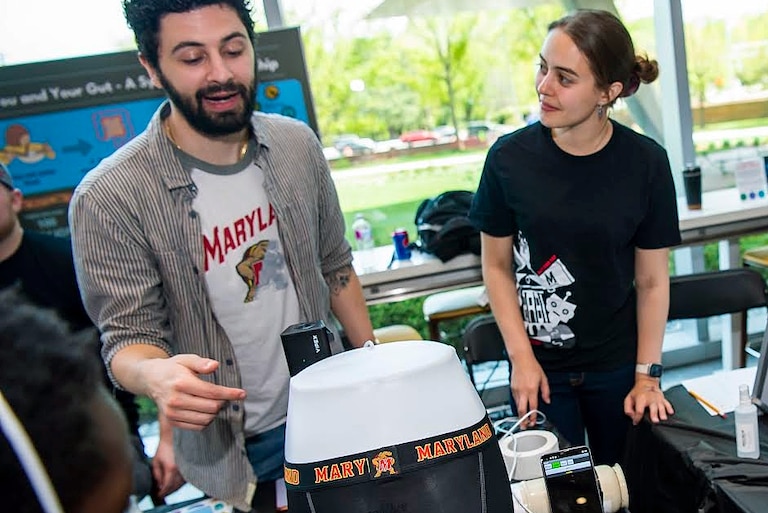 Brantley Hall, left, demoing a Smart Underwear Prototype, a wearable device that uses sensors to track the wearer’s intestinal gas.