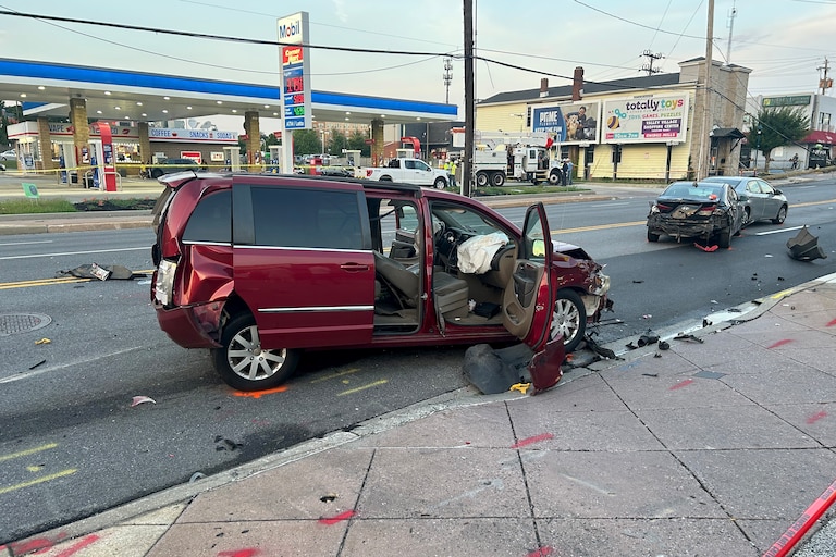 Baltimore County fire crews responded to the scene of a major accident in Pikesville after a bus crashed into a building Wednesday, leaving up to 30 people injured, one critically. The red mini van was seen running into a black Honda Elantra.