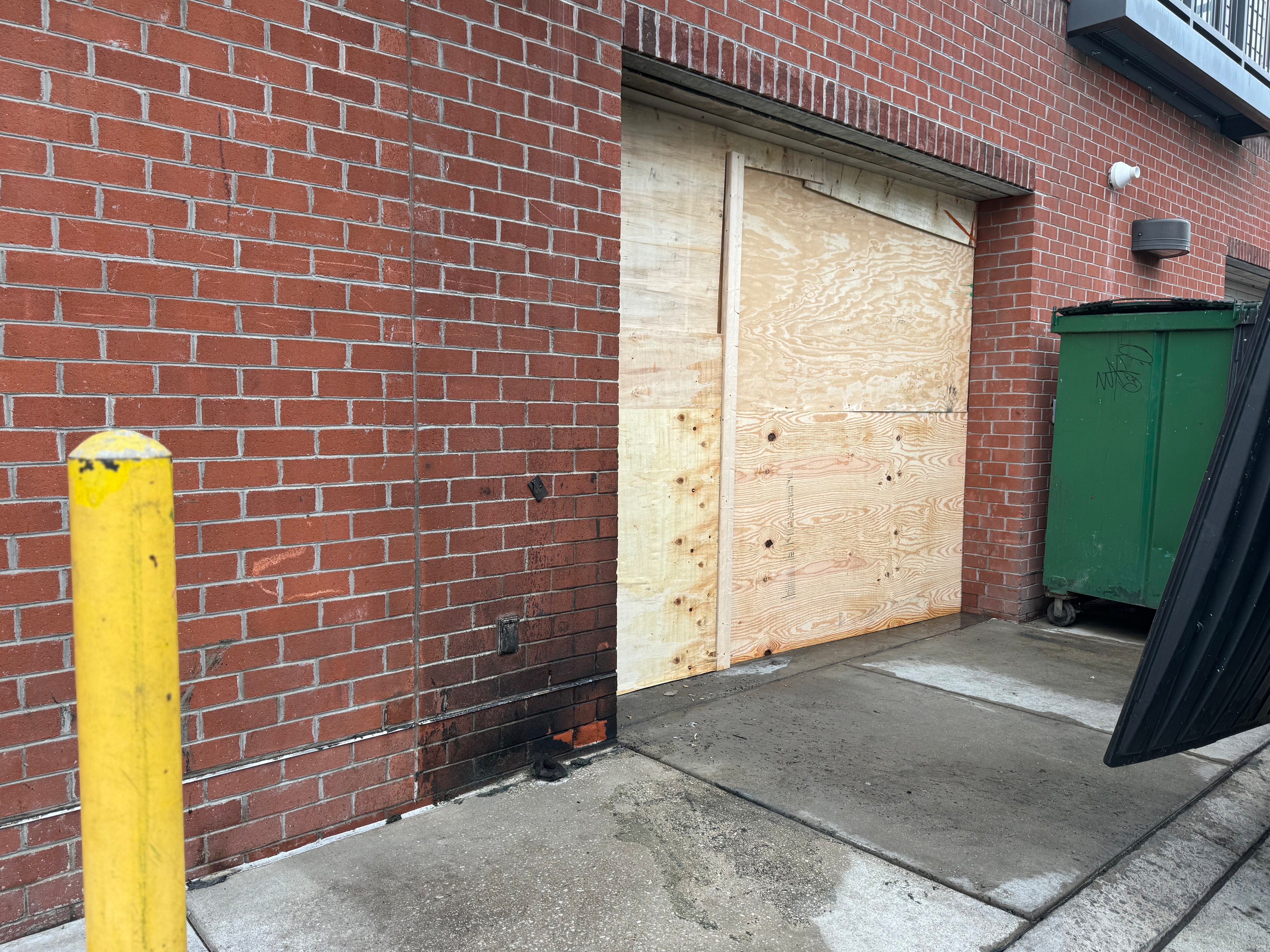 The exterior of Papi Cuisine was mostly cleaned up by early Monday evening after a fire outside its back door.