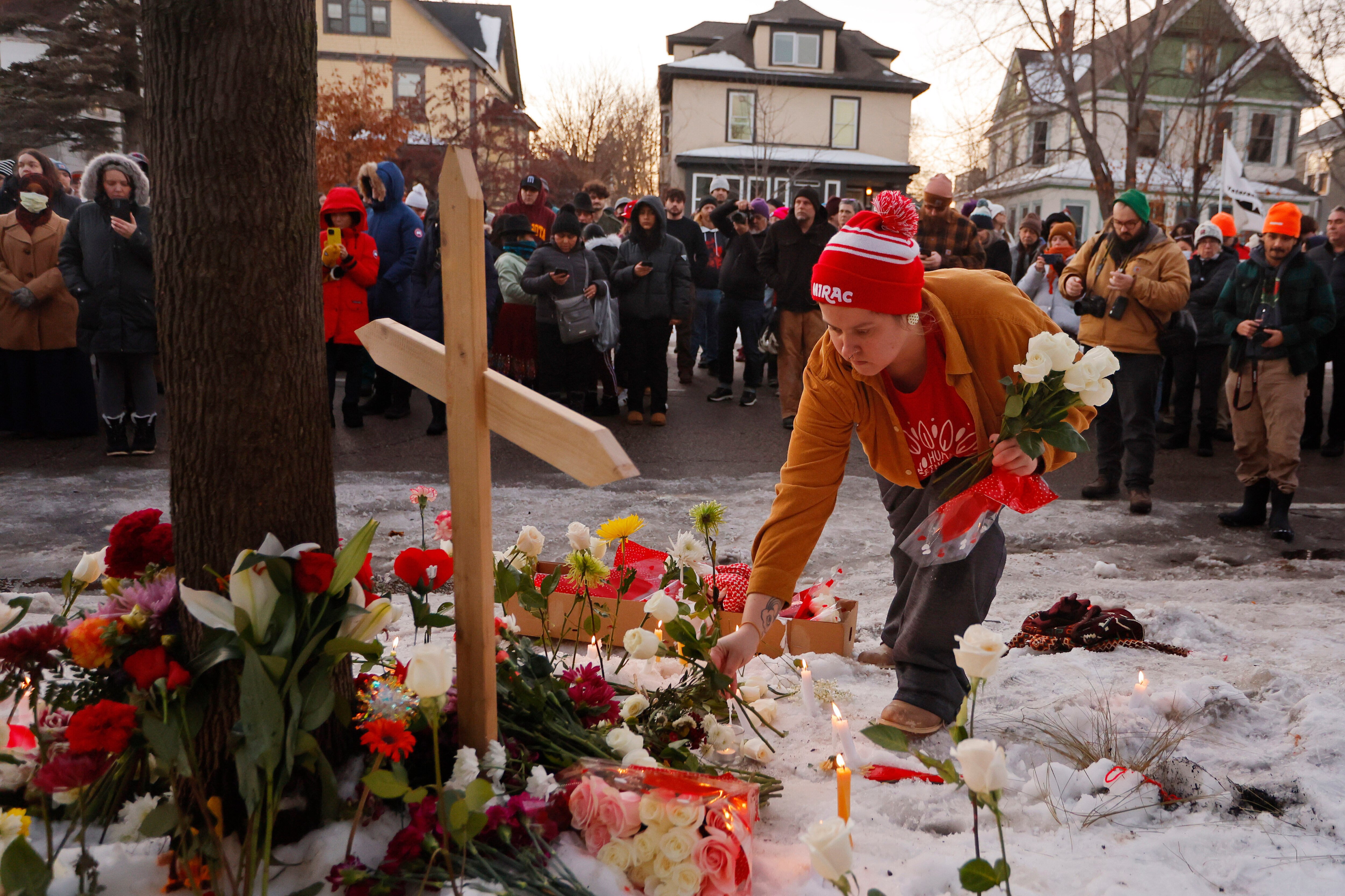 People gather for a vigil after an Immigration and Customs Enforcement officer shot and killed a motorist earlier in the day, Wednesday, Jan. 7, 2026, in Minneapolis.